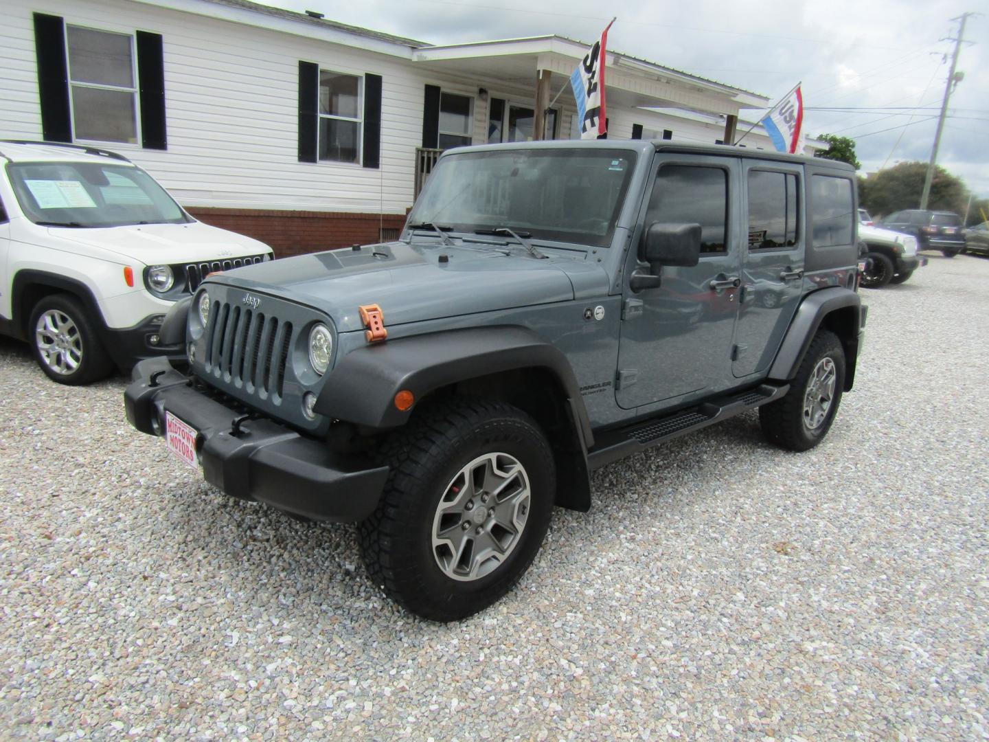 2014 Gray Jeep Wrangler Unlimited Rubicon 4WD (1C4HJWFG1EL) with an 3.6L V6 DOHC 24V FFV engine, Automatic transmission, located at 15016 S Hwy 231, Midland City, AL, 36350, (334) 983-3001, 31.306210, -85.495277- Photo#2