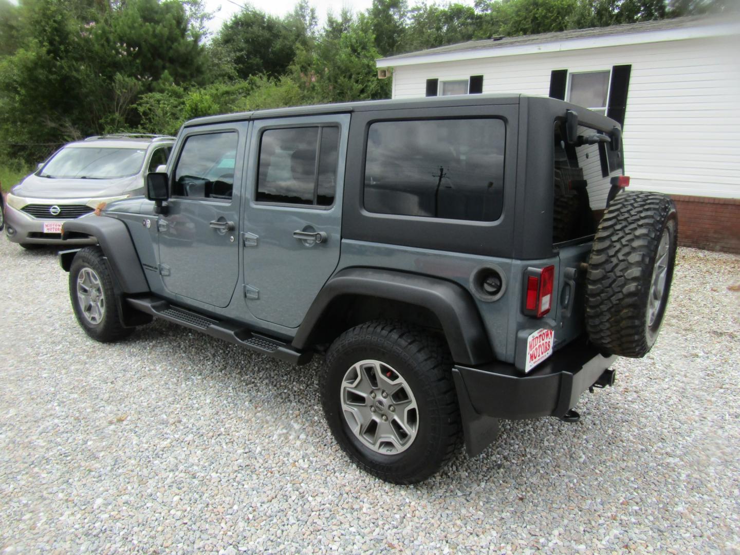 2014 Gray Jeep Wrangler Unlimited Rubicon 4WD (1C4HJWFG1EL) with an 3.6L V6 DOHC 24V FFV engine, Automatic transmission, located at 15016 S Hwy 231, Midland City, AL, 36350, (334) 983-3001, 31.306210, -85.495277- Photo#5