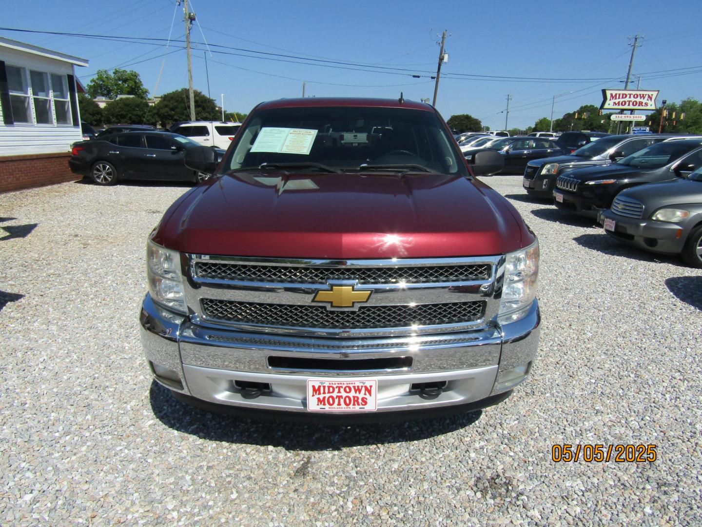 2013 Red Chevrolet Silverado 1500 LT Crew Cab 4WD (3GCPKSE79DG) with an 5.3L V8 OHV 16V FFV engine, Automatic transmission, located at 15016 S Hwy 231, Midland City, AL, 36350, (334) 983-3001, 31.306210, -85.495277 - Photo#1