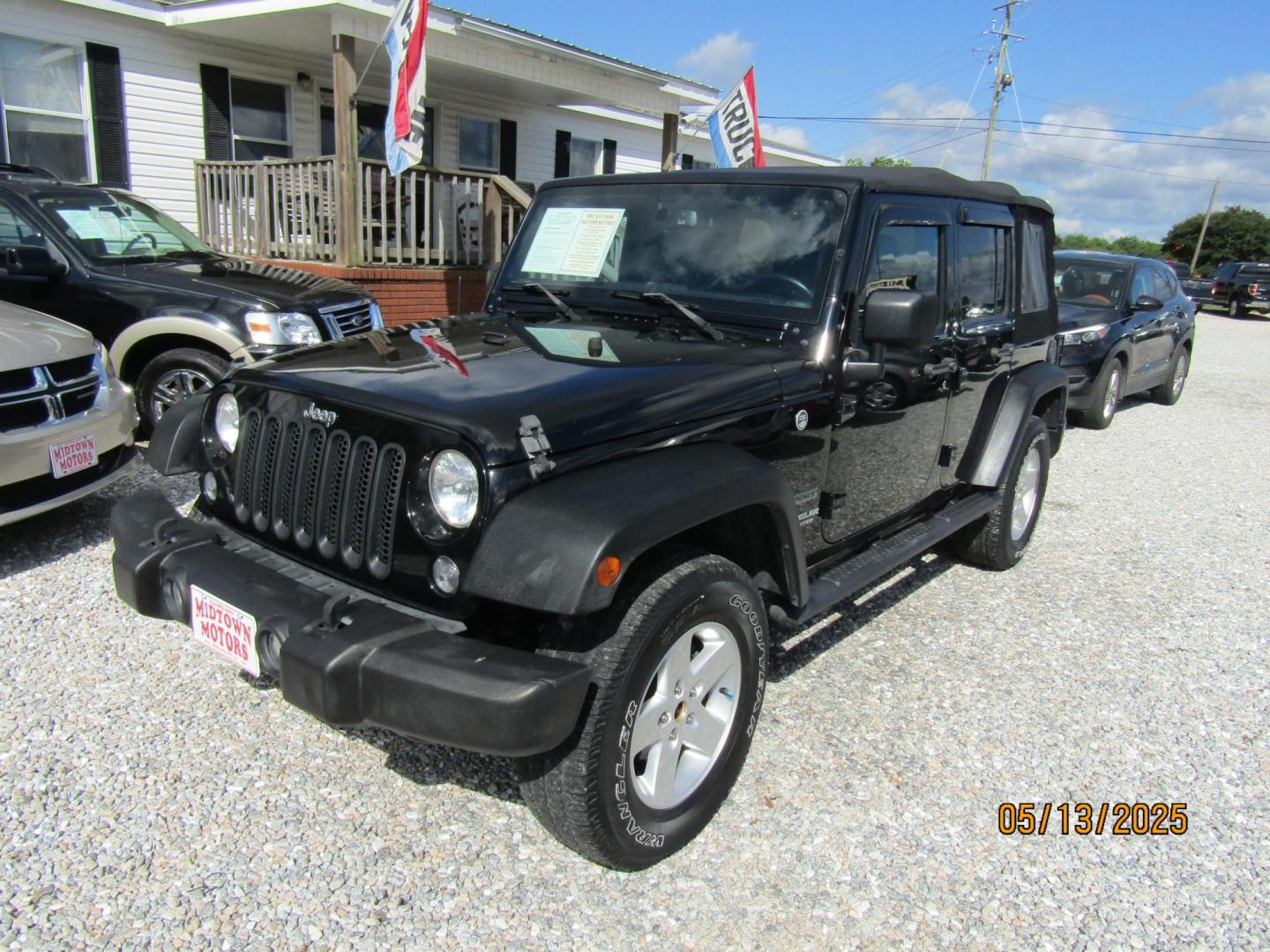 2016 Black Jeep Wrangler Unlimited Sport 4WD (1C4BJWDG5GL) with an 3.6L V6 DOHC 24V FFV engine, Automatic transmission, located at 15016 S Hwy 231, Midland City, AL, 36350, (334) 983-3001, 31.306210, -85.495277 - Photo#2