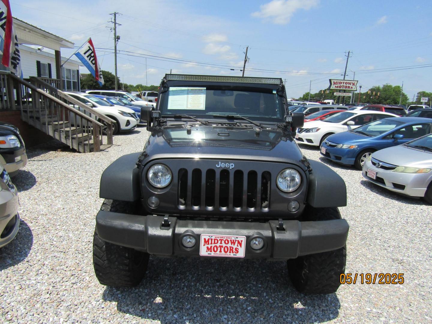 2017 Gray Jeep Wrangler Unlimited Sport 4WD (1C4BJWDG2HL) with an 3.6L V6 DOHC 24V FFV engine, Automatic transmission, located at 15016 S Hwy 231, Midland City, AL, 36350, (334) 983-3001, 31.306210, -85.495277 - Photo#1