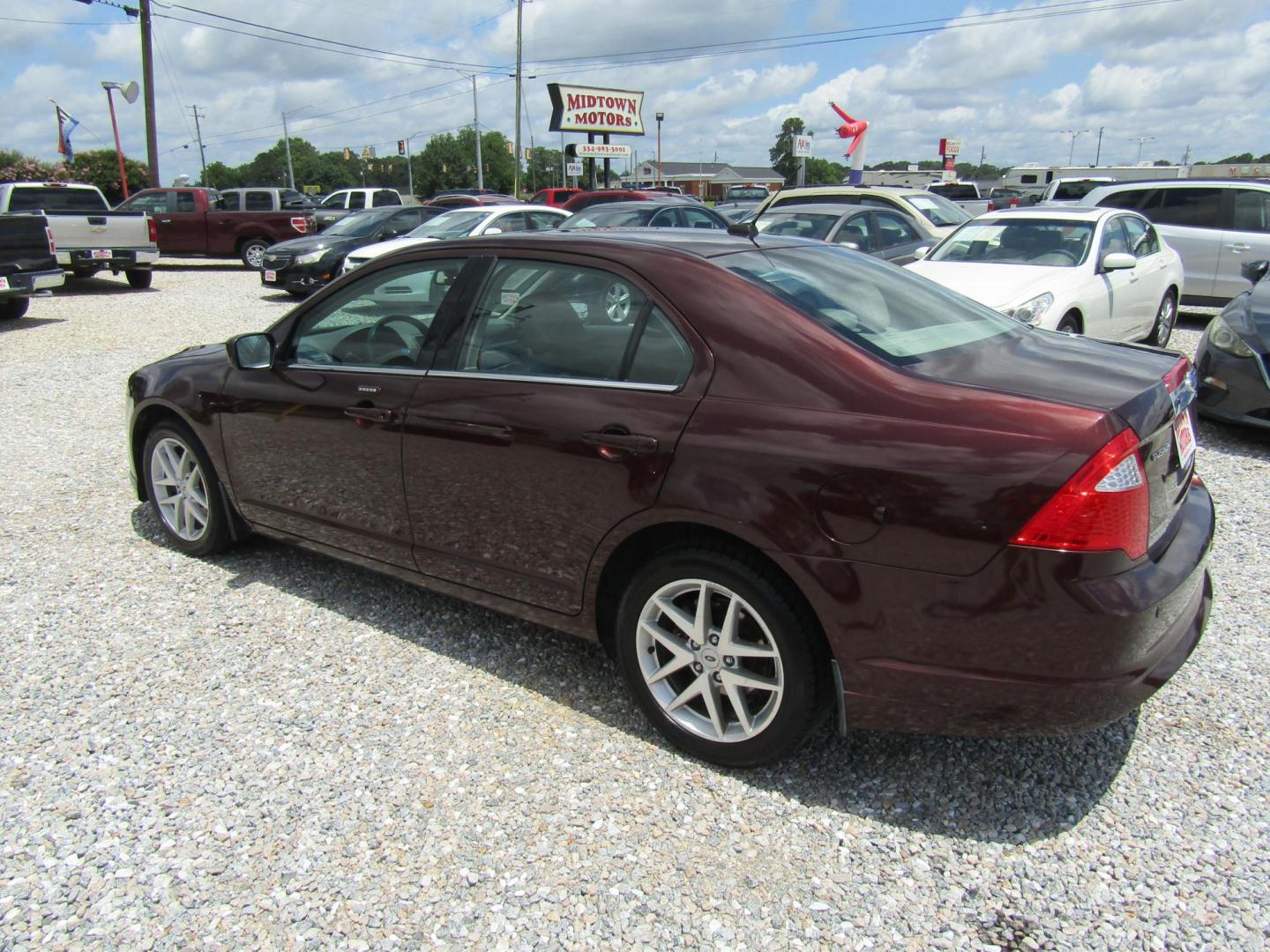 2012 Burgandy Ford Fusion SEL (3FAHP0JA1CR) with an 2.5L L4 DOHC 16V engine, Automatic transmission, located at 15016 S Hwy 231, Midland City, AL, 36350, (334) 983-3001, 31.306210, -85.495277 - Photo#5