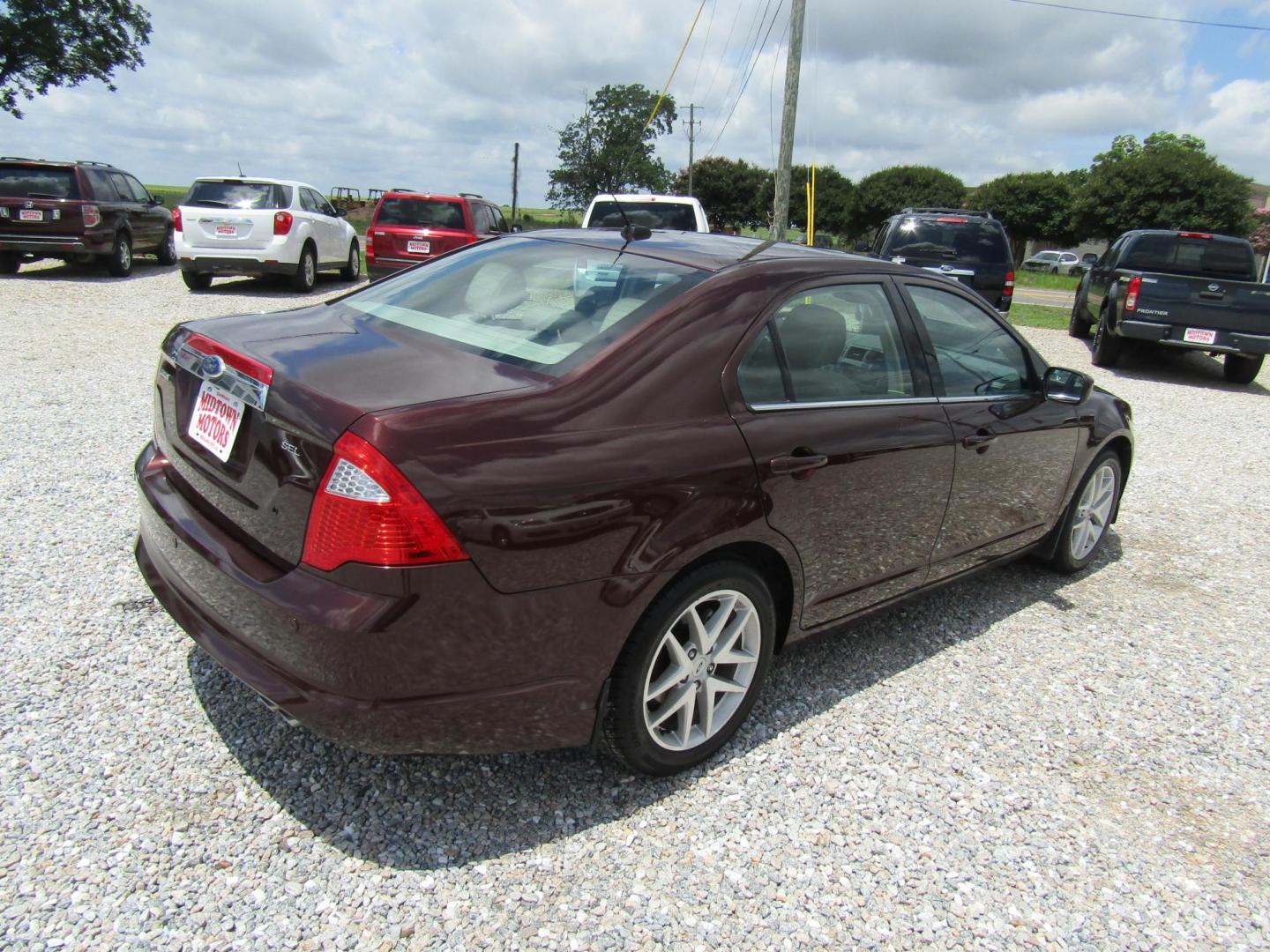 2012 Burgandy Ford Fusion SEL (3FAHP0JA1CR) with an 2.5L L4 DOHC 16V engine, Automatic transmission, located at 15016 S Hwy 231, Midland City, AL, 36350, (334) 983-3001, 31.306210, -85.495277 - Photo#7
