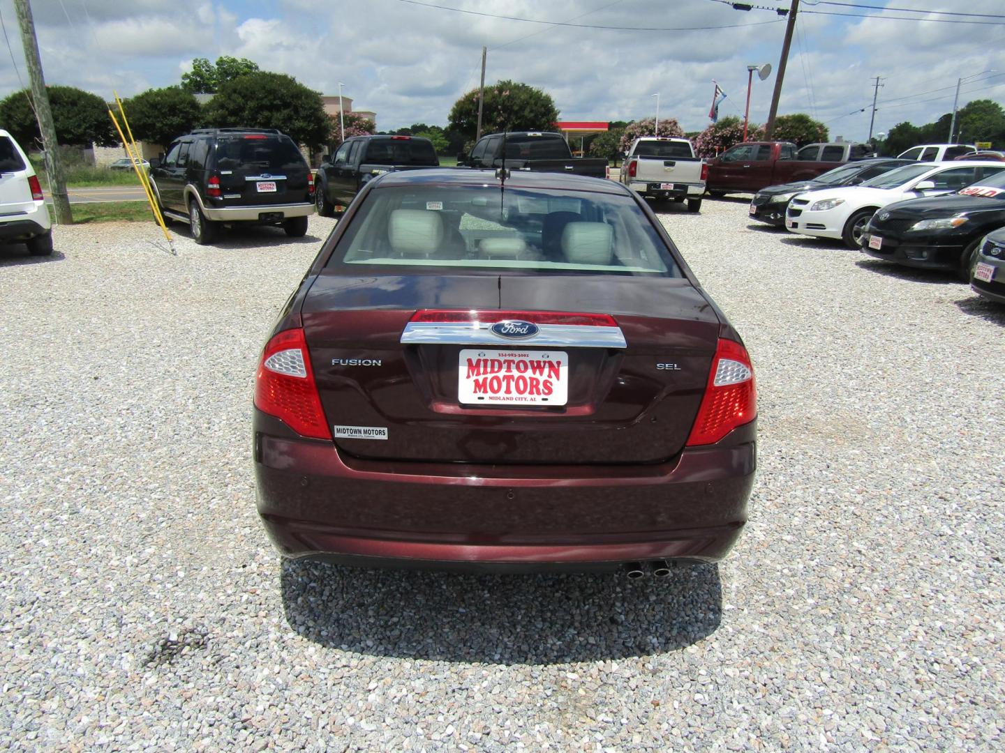 2012 Burgandy Ford Fusion SEL (3FAHP0JA1CR) with an 2.5L L4 DOHC 16V engine, Automatic transmission, located at 15016 S Hwy 231, Midland City, AL, 36350, (334) 983-3001, 31.306210, -85.495277 - Photo#6