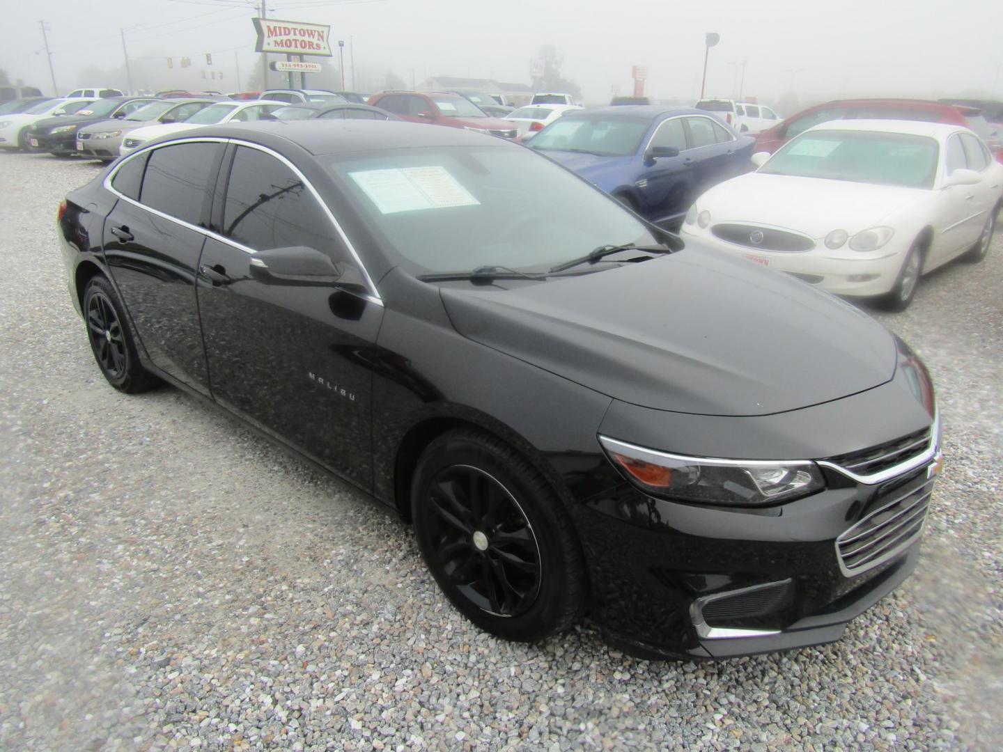 2016 Black Chevrolet Malibu 1LT (1G1ZE5ST0GF) with an 1.5L L4 DOHC 16V engine, Automatic transmission, located at 15016 S Hwy 231, Midland City, AL, 36350, (334) 983-3001, 31.306210, -85.495277 - Photo#0