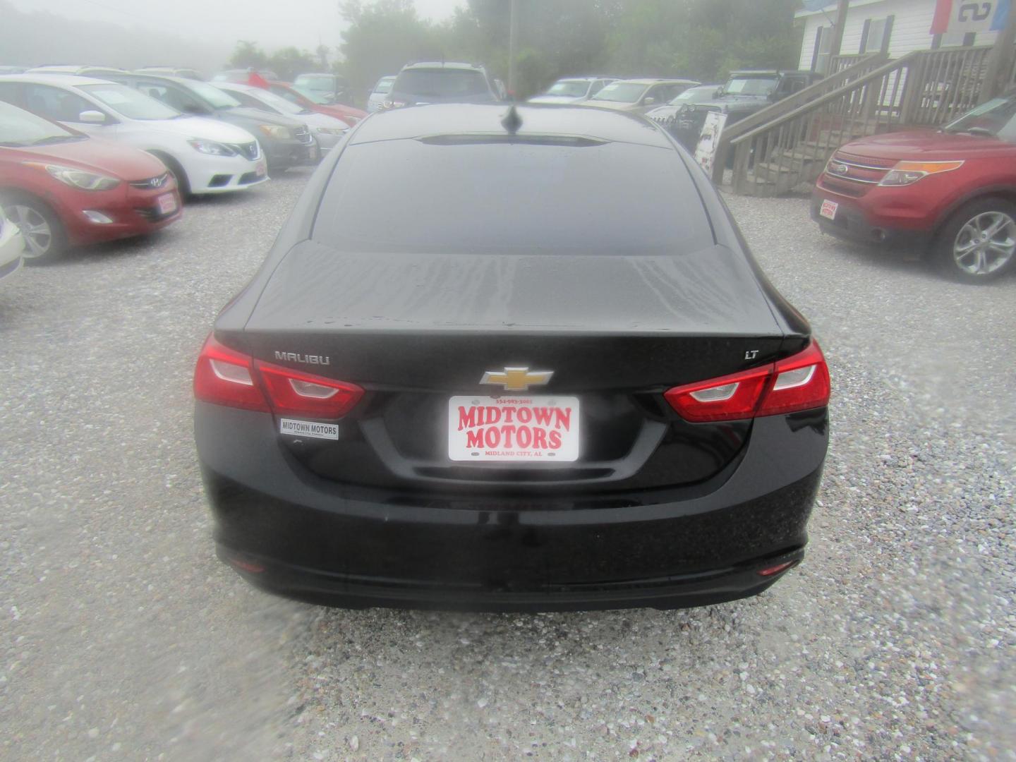 2016 Black Chevrolet Malibu 1LT (1G1ZE5ST0GF) with an 1.5L L4 DOHC 16V engine, Automatic transmission, located at 15016 S Hwy 231, Midland City, AL, 36350, (334) 983-3001, 31.306210, -85.495277 - Photo#6