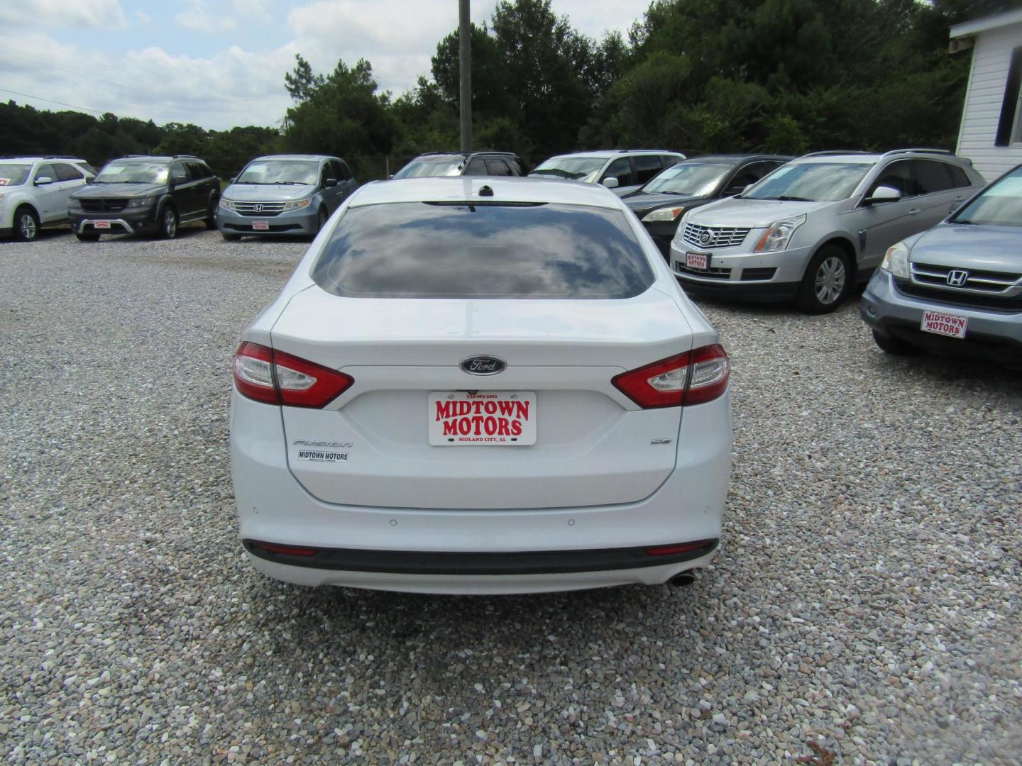 2015 WHITE Ford Fusion SE (1FA6P0H79F5) with an 2.5L L4 DOHC 16V engine, Automatic transmission, located at 15016 S Hwy 231, Midland City, AL, 36350, (334) 983-3001, 31.306210, -85.495277 - Photo#6