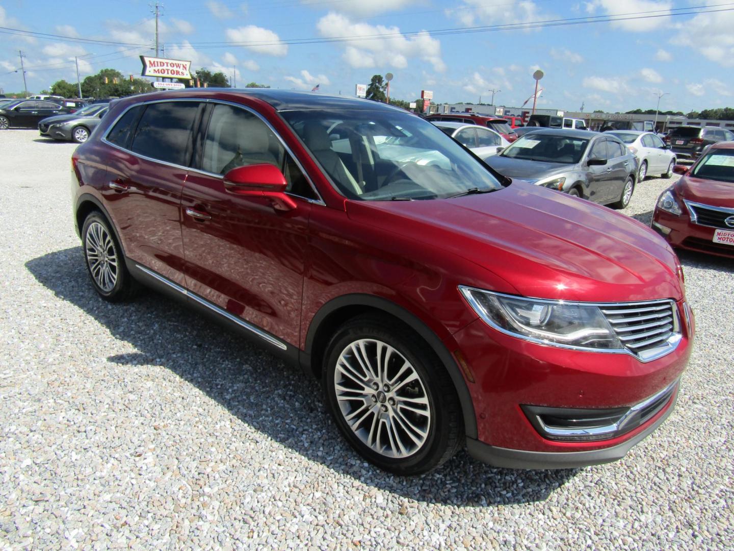 2016 Red Lincoln MKX Reserve (2LMTJ6LP5GB) with an 2.7L V6 DOHC 24V engine, Automatic transmission, located at 15016 S Hwy 231, Midland City, AL, 36350, (334) 983-3001, 31.306210, -85.495277 - Photo#0
