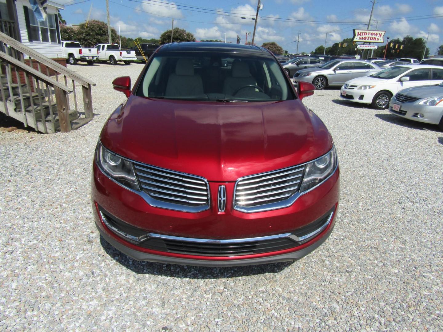 2016 Red Lincoln MKX Reserve (2LMTJ6LP5GB) with an 2.7L V6 DOHC 24V engine, Automatic transmission, located at 15016 S Hwy 231, Midland City, AL, 36350, (334) 983-3001, 31.306210, -85.495277 - Photo#1