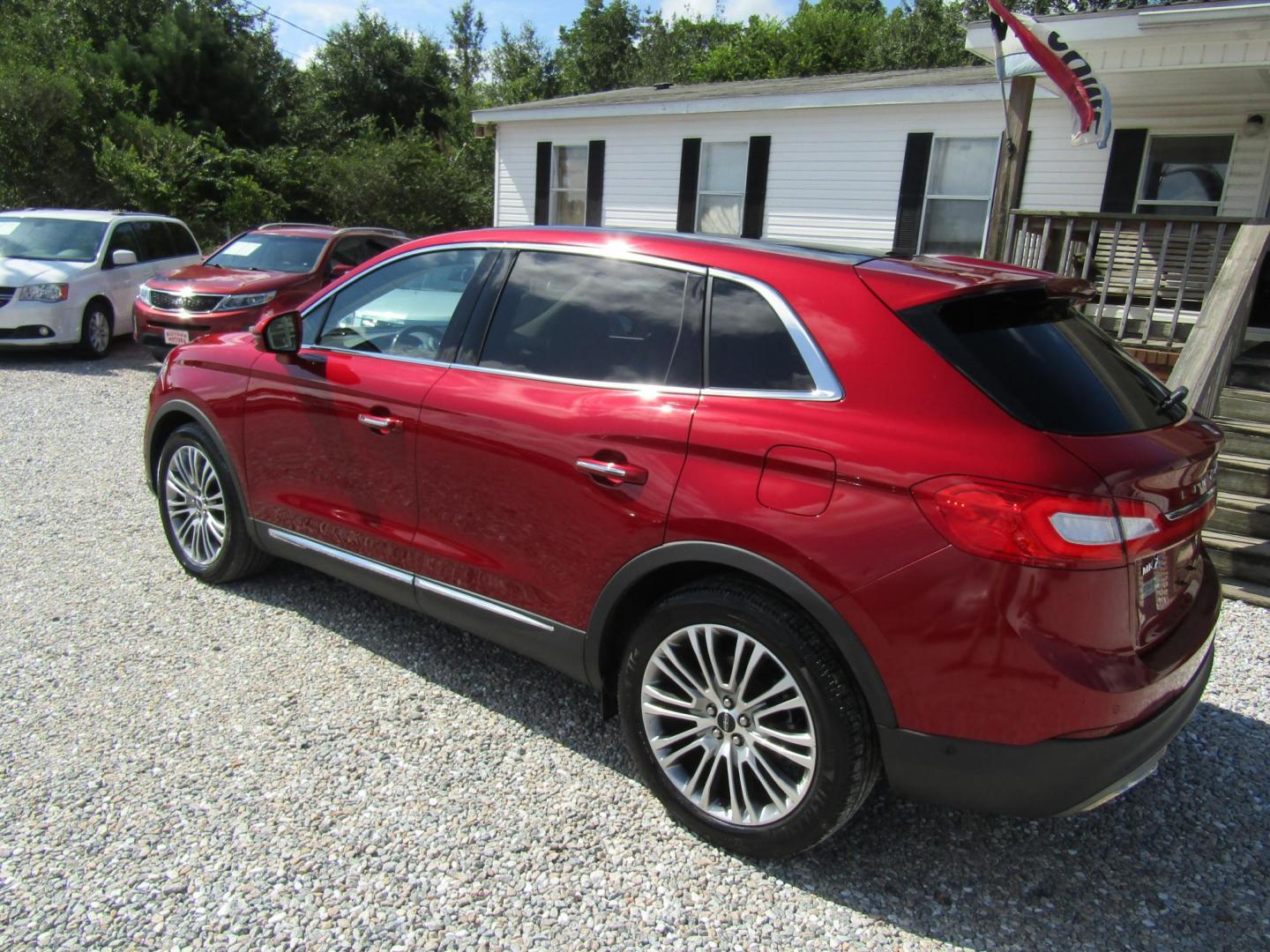 2016 Red Lincoln MKX Reserve (2LMTJ6LP5GB) with an 2.7L V6 DOHC 24V engine, Automatic transmission, located at 15016 S Hwy 231, Midland City, AL, 36350, (334) 983-3001, 31.306210, -85.495277 - Photo#5