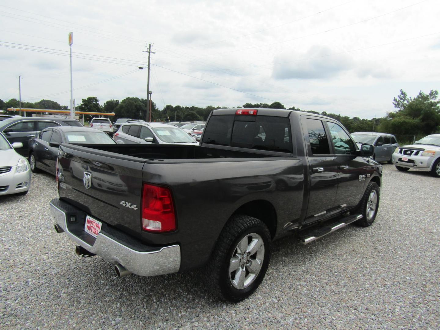 2015 DK GRAY RAM 1500 SLT Quad Cab 4WD (1C6RR7GT1FS) with an 5.7L V8 OHV 16V engine, Automatic transmission, located at 15016 S Hwy 231, Midland City, AL, 36350, (334) 983-3001, 31.306210, -85.495277 - Photo#7