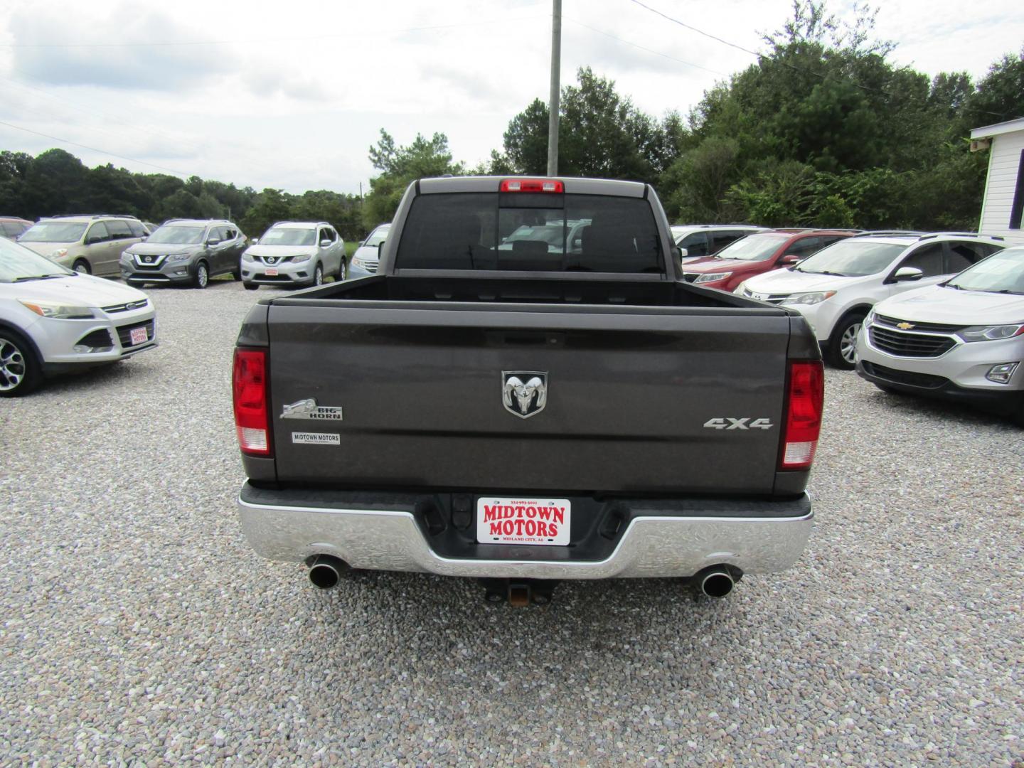 2015 DK GRAY RAM 1500 SLT Quad Cab 4WD (1C6RR7GT1FS) with an 5.7L V8 OHV 16V engine, Automatic transmission, located at 15016 S Hwy 231, Midland City, AL, 36350, (334) 983-3001, 31.306210, -85.495277 - Photo#6