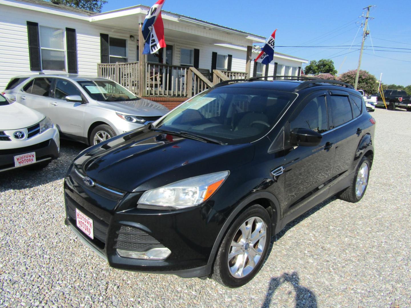 2013 Black Ford Escape SE FWD (1FMCU0GX9DU) with an 1.6L L4 DOHC 16V engine, Automatic transmission, located at 15016 S Hwy 231, Midland City, AL, 36350, (334) 983-3001, 31.306210, -85.495277 - Photo#2