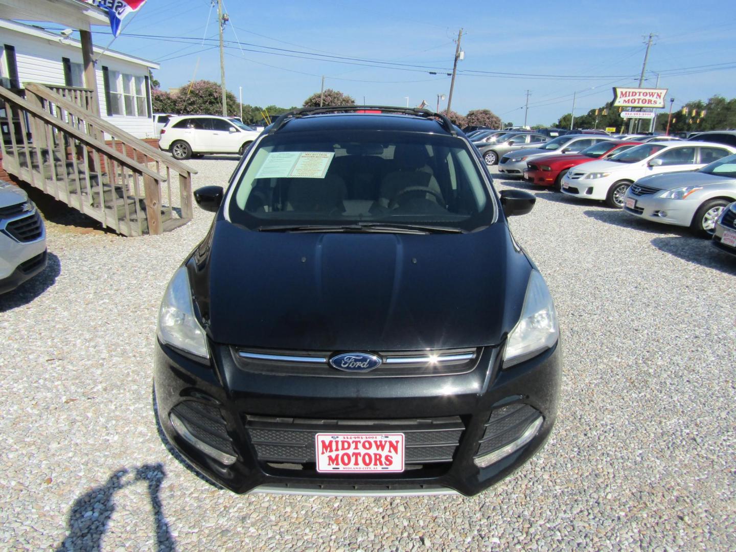 2013 Black Ford Escape SE FWD (1FMCU0GX9DU) with an 1.6L L4 DOHC 16V engine, Automatic transmission, located at 15016 S Hwy 231, Midland City, AL, 36350, (334) 983-3001, 31.306210, -85.495277 - Photo#1
