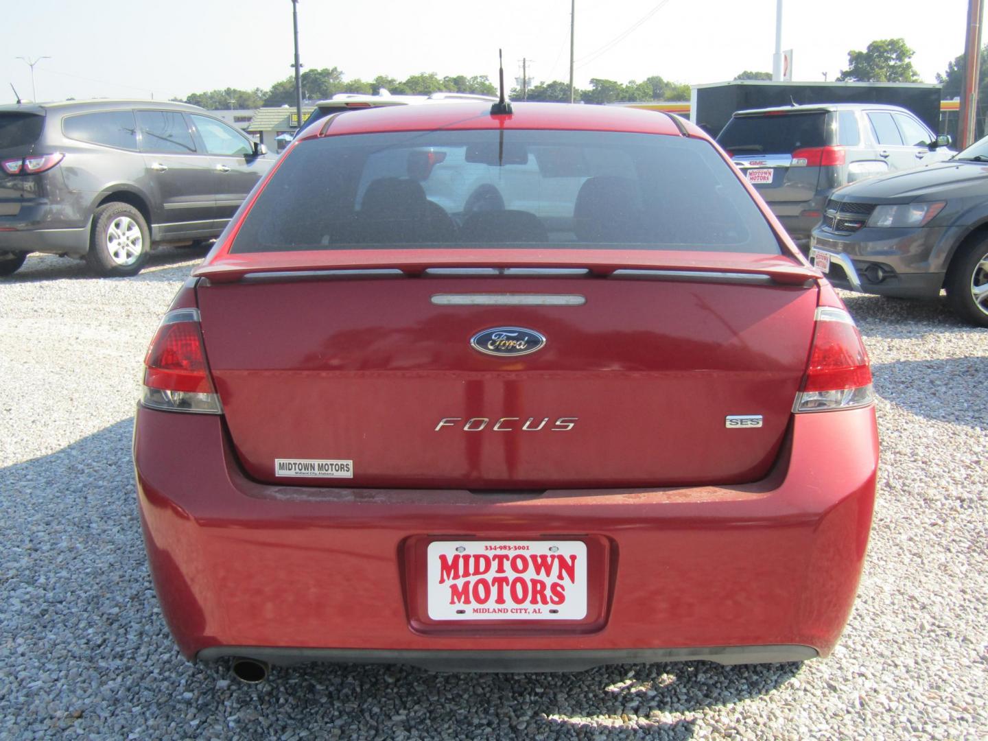 2011 Red Ford Focus SES Sedan (1FAHP3GN1BW) with an 2.0L L4 DOHC 16V engine, Automatic transmission, located at 15016 S Hwy 231, Midland City, AL, 36350, (334) 983-3001, 31.306210, -85.495277 - Photo#6