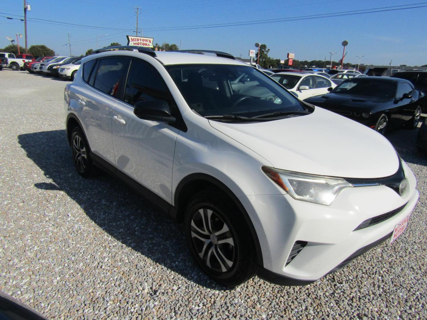 2018 WHITE Toyota RAV4 LE FWD (JTMZFREV6JJ) with an 2.5L L4 DOHC 16V engine, Automatic transmission, located at 15016 S Hwy 231, Midland City, AL, 36350, (334) 983-3001, 31.306210, -85.495277 - Photo#0