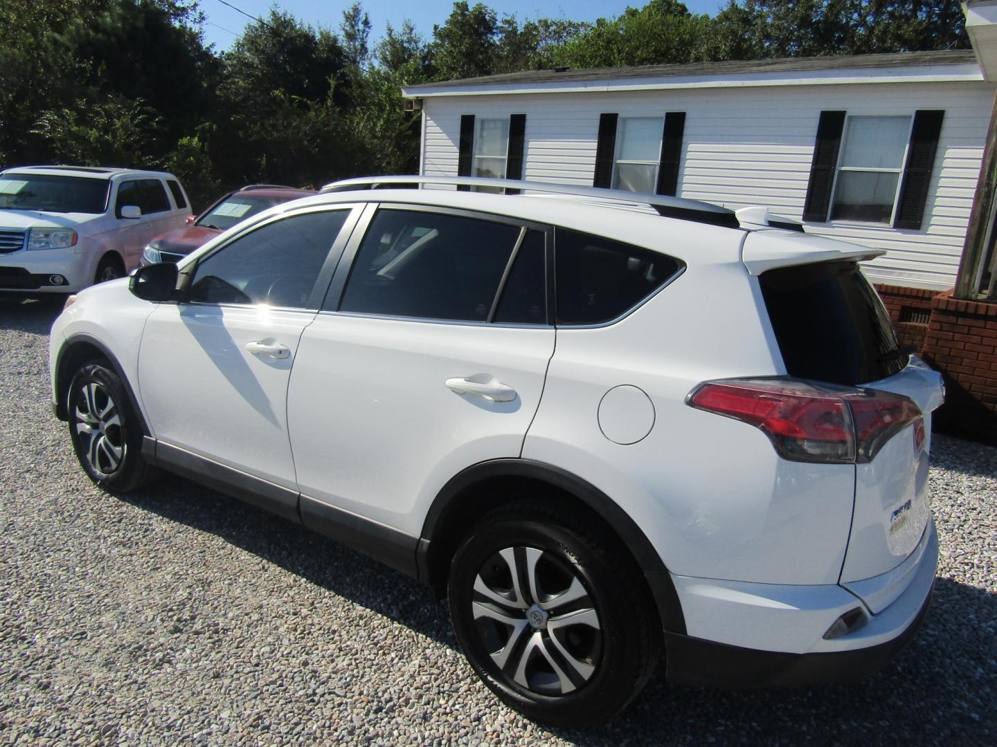 2018 WHITE Toyota RAV4 LE FWD (JTMZFREV6JJ) with an 2.5L L4 DOHC 16V engine, Automatic transmission, located at 15016 S Hwy 231, Midland City, AL, 36350, (334) 983-3001, 31.306210, -85.495277 - Photo#4