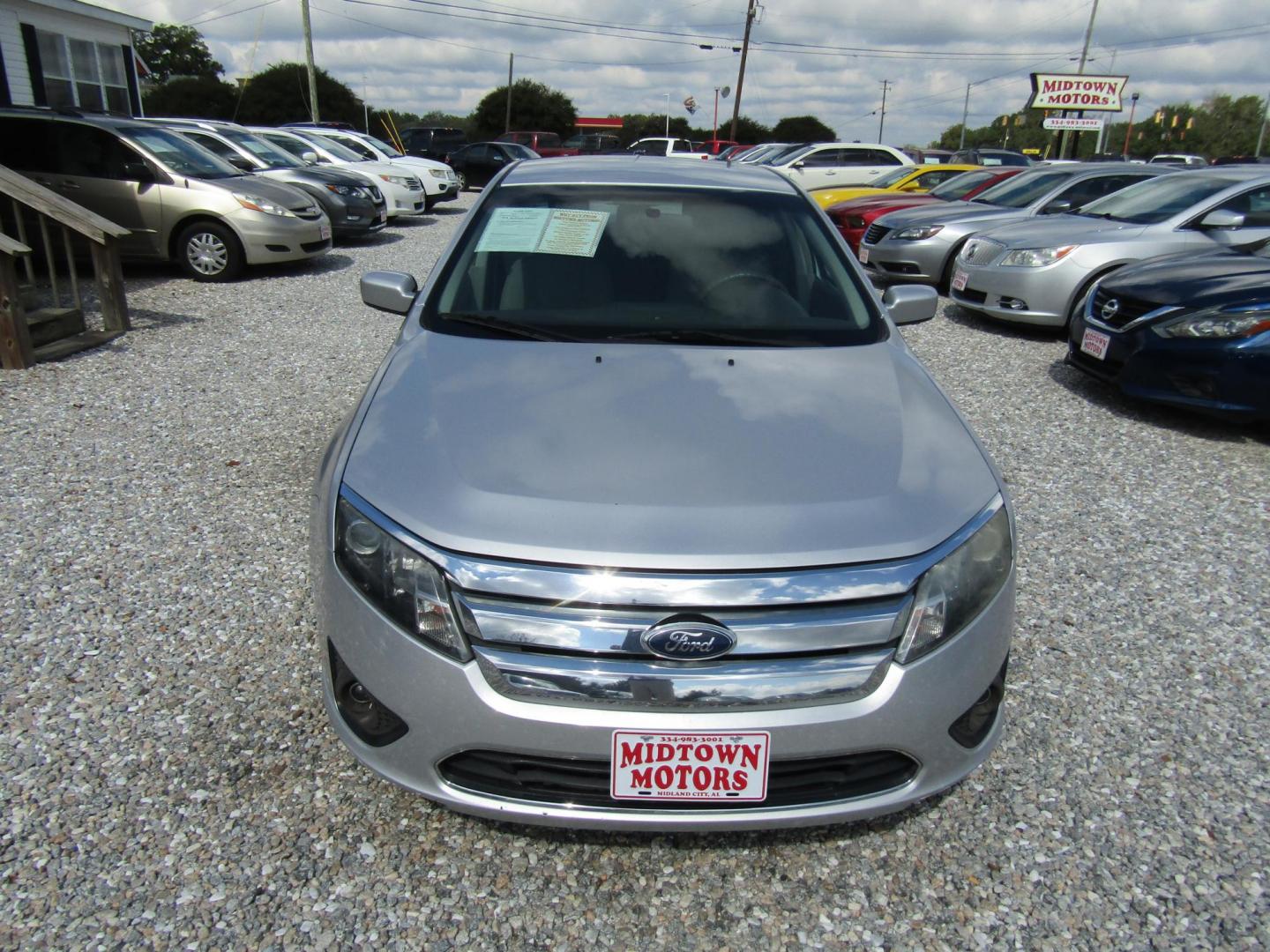 2012 Silver Ford Fusion SE (3FAHP0HA7CR) with an 2.5L L4 DOHC 16V engine, Automatic transmission, located at 15016 S Hwy 231, Midland City, AL, 36350, (334) 983-3001, 31.306210, -85.495277 - Photo#1
