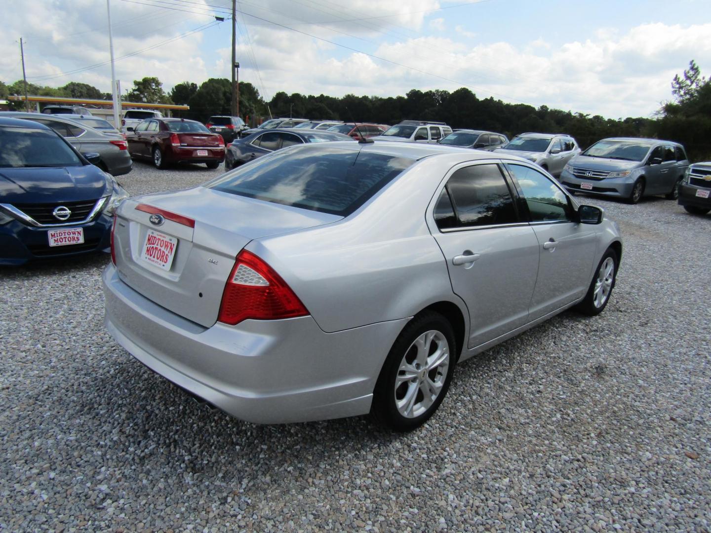 2012 Silver Ford Fusion SE (3FAHP0HA7CR) with an 2.5L L4 DOHC 16V engine, Automatic transmission, located at 15016 S Hwy 231, Midland City, AL, 36350, (334) 983-3001, 31.306210, -85.495277 - Photo#6