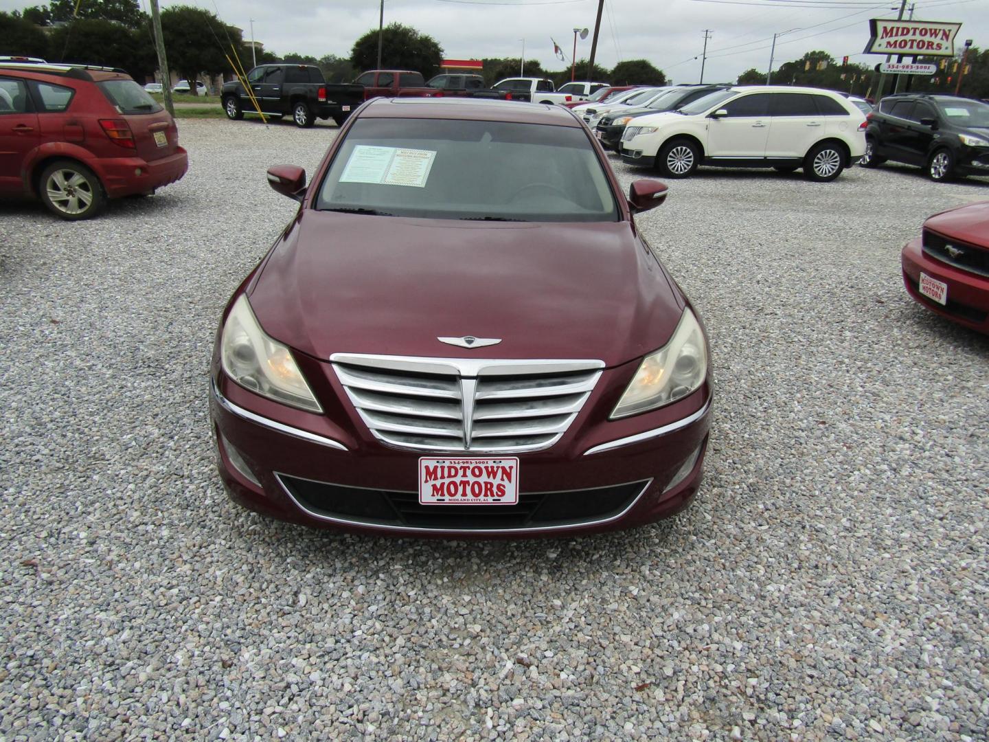 2013 Red Hyundai Genesis 3.8L (KMHGC4DD5DU) with an 3.8L V6 DOHC 24V engine, Automatic transmission, located at 15016 S Hwy 231, Midland City, AL, 36350, (334) 983-3001, 31.306210, -85.495277 - Photo#1