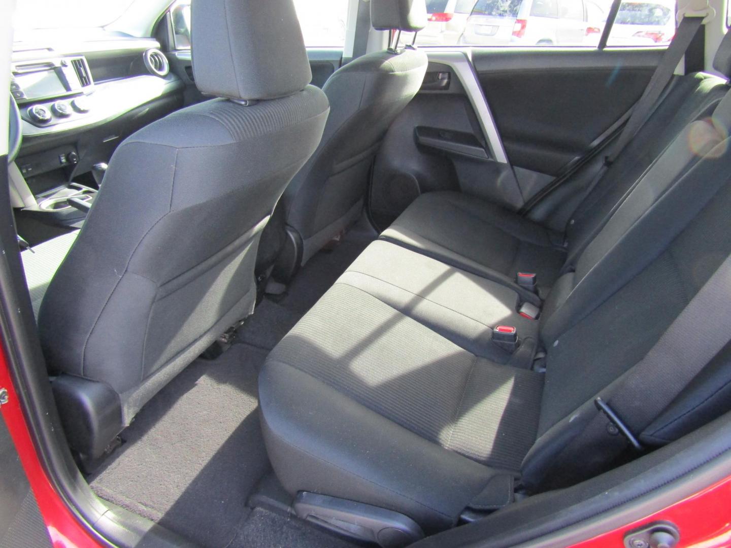 2016 Red Toyota RAV4 LE FWD (2T3ZFREV3GW) with an 2.5L L4 DOHC 16V engine, Automatic transmission, located at 15016 S Hwy 231, Midland City, AL, 36350, (334) 983-3001, 31.306210, -85.495277 - Photo#4