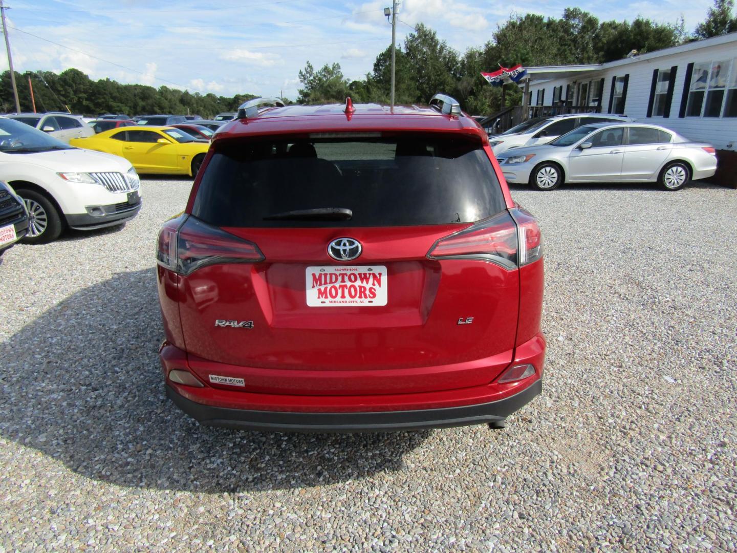 2016 Red Toyota RAV4 LE FWD (2T3ZFREV3GW) with an 2.5L L4 DOHC 16V engine, Automatic transmission, located at 15016 S Hwy 231, Midland City, AL, 36350, (334) 983-3001, 31.306210, -85.495277 - Photo#6