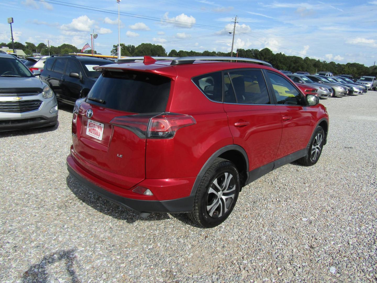 2016 Red Toyota RAV4 LE FWD (2T3ZFREV3GW) with an 2.5L L4 DOHC 16V engine, Automatic transmission, located at 15016 S Hwy 231, Midland City, AL, 36350, (334) 983-3001, 31.306210, -85.495277 - Photo#7