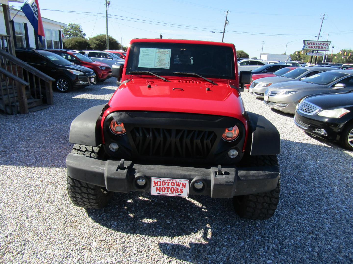2015 Red Jeep Wrangler Sport 4WD (1C4AJWAG3FL) with an 3.6L V6 DOHC 24V FFV engine, Automatic transmission, located at 15016 S Hwy 231, Midland City, AL, 36350, (334) 983-3001, 31.306210, -85.495277 - Photo#1