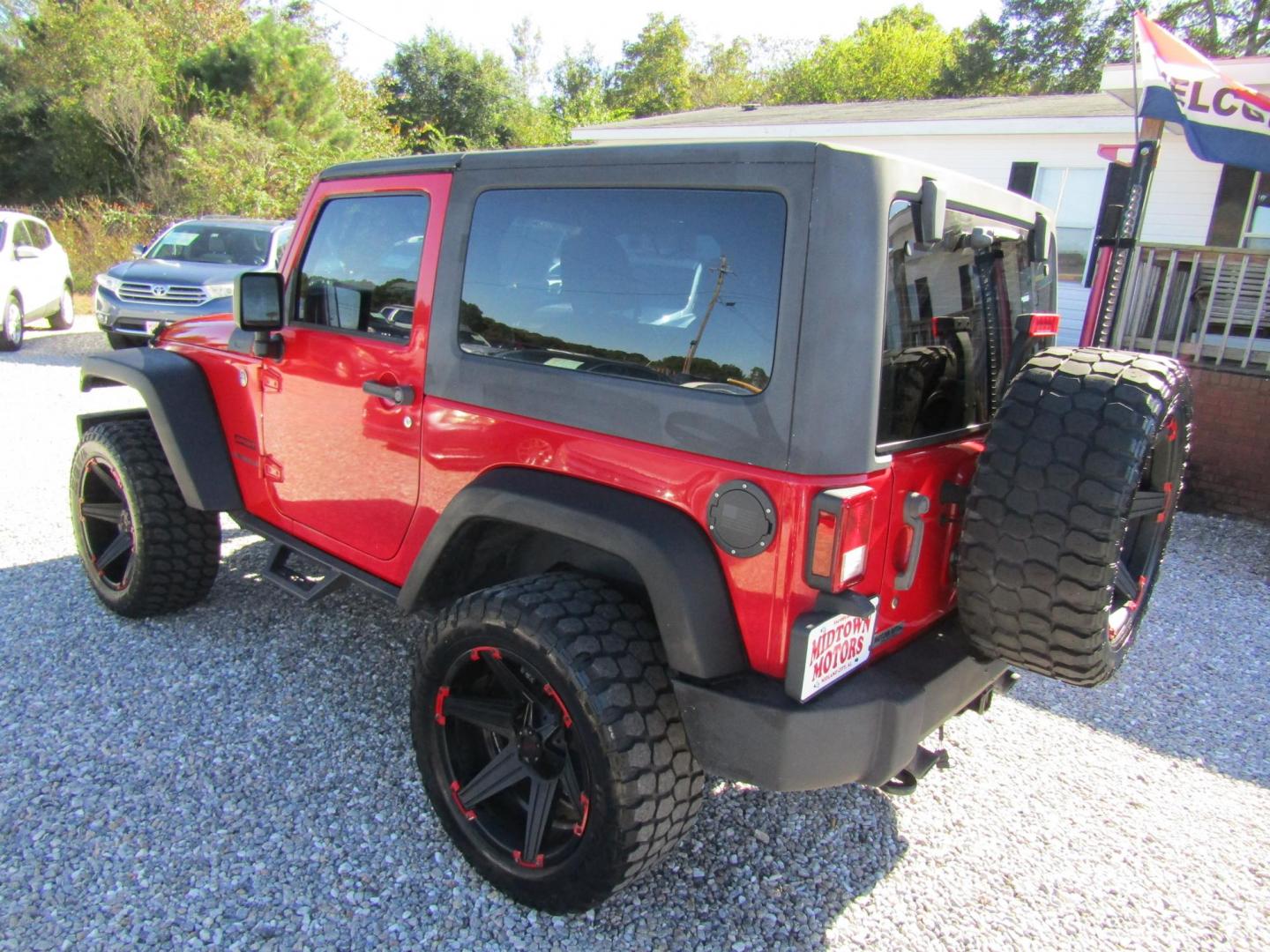 2015 Red Jeep Wrangler Sport 4WD (1C4AJWAG3FL) with an 3.6L V6 DOHC 24V FFV engine, Automatic transmission, located at 15016 S Hwy 231, Midland City, AL, 36350, (334) 983-3001, 31.306210, -85.495277 - Photo#4