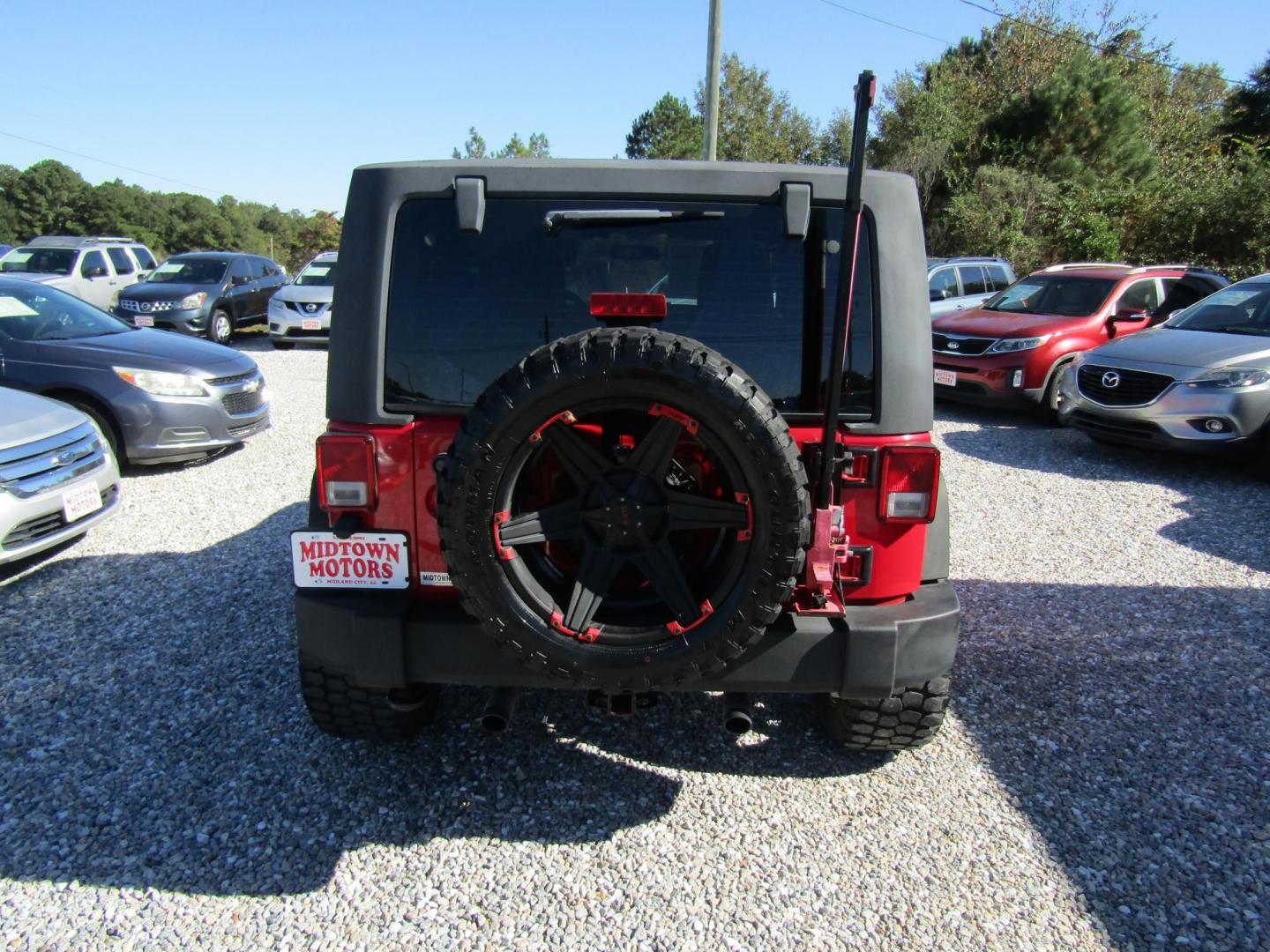 2015 Red Jeep Wrangler Sport 4WD (1C4AJWAG3FL) with an 3.6L V6 DOHC 24V FFV engine, Automatic transmission, located at 15016 S Hwy 231, Midland City, AL, 36350, (334) 983-3001, 31.306210, -85.495277 - Photo#5