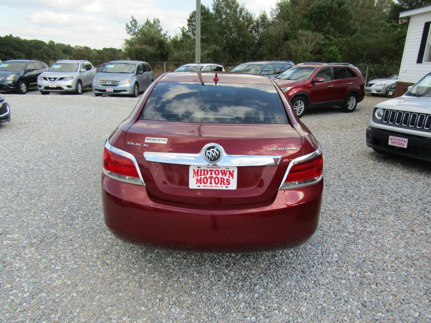2010 Red Buick LaCrosse CX (1G4GB5EG9AF) with an 3.0L V6 DOHC 24V engine, Automatic transmission, located at 15016 S Hwy 231, Midland City, AL, 36350, (334) 983-3001, 31.306210, -85.495277 - Photo#6