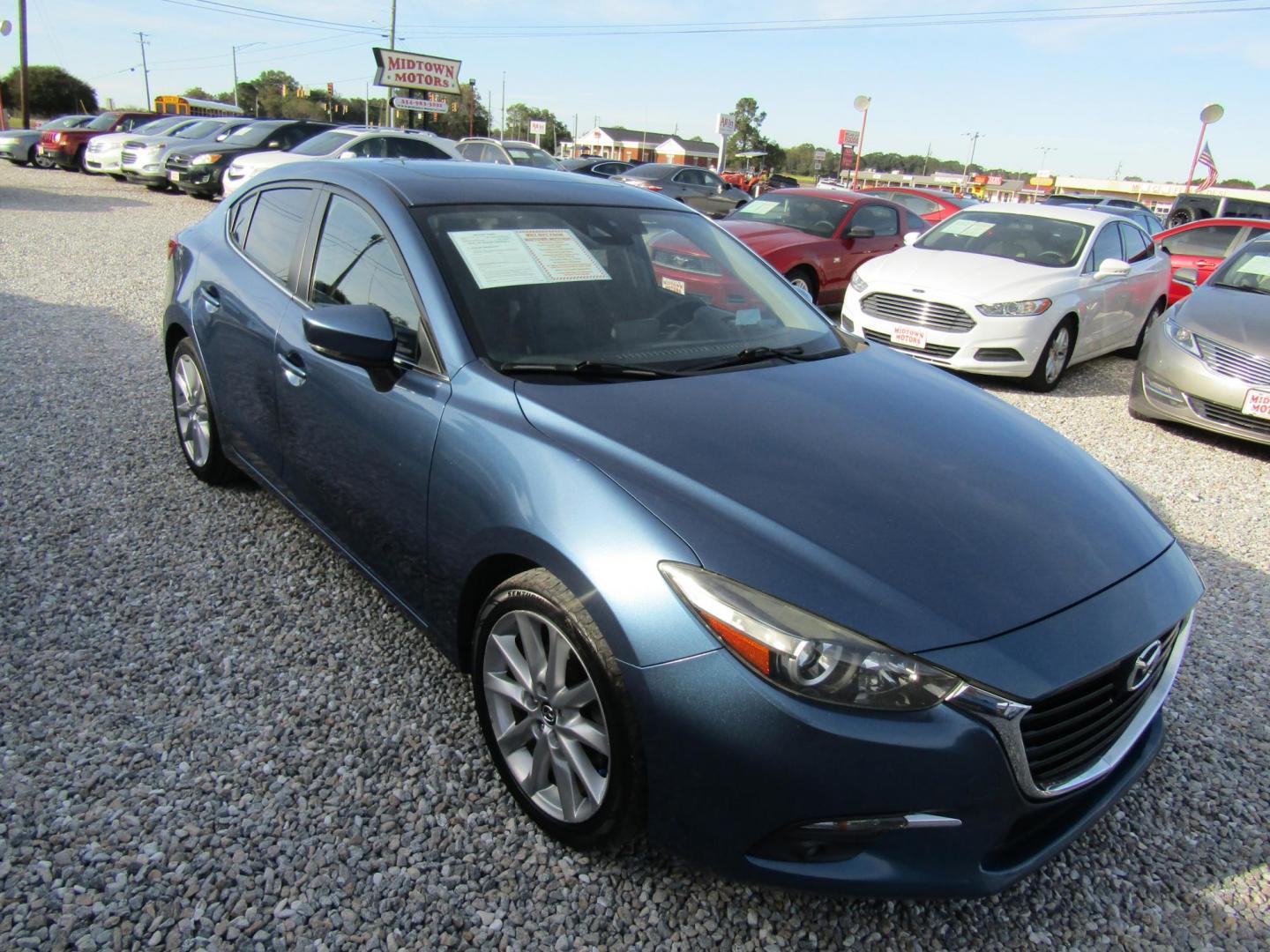 2017 Blue Mazda MAZDA3 s Grand Touring AT 4-Door (JM1BN1W31H1) with an 2.5L L4 DOHC 16V engine, Automatic transmission, located at 15016 S Hwy 231, Midland City, AL, 36350, (334) 983-3001, 31.306210, -85.495277 - Photo#0