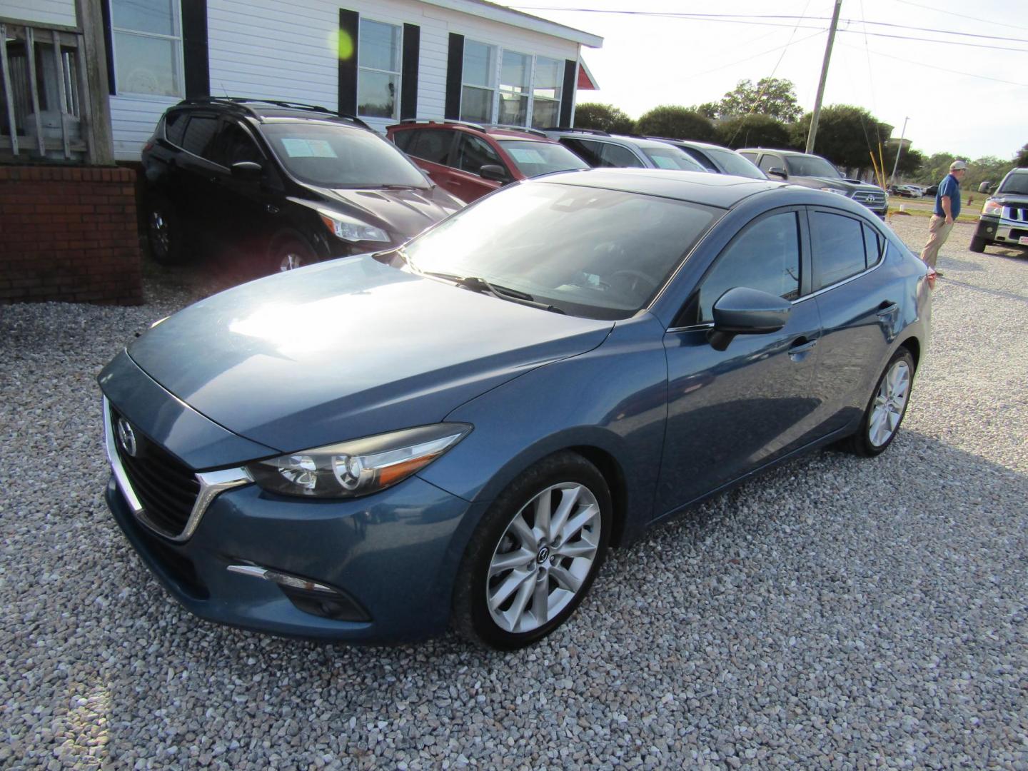 2017 Blue Mazda MAZDA3 s Grand Touring AT 4-Door (JM1BN1W31H1) with an 2.5L L4 DOHC 16V engine, Automatic transmission, located at 15016 S Hwy 231, Midland City, AL, 36350, (334) 983-3001, 31.306210, -85.495277 - Photo#2