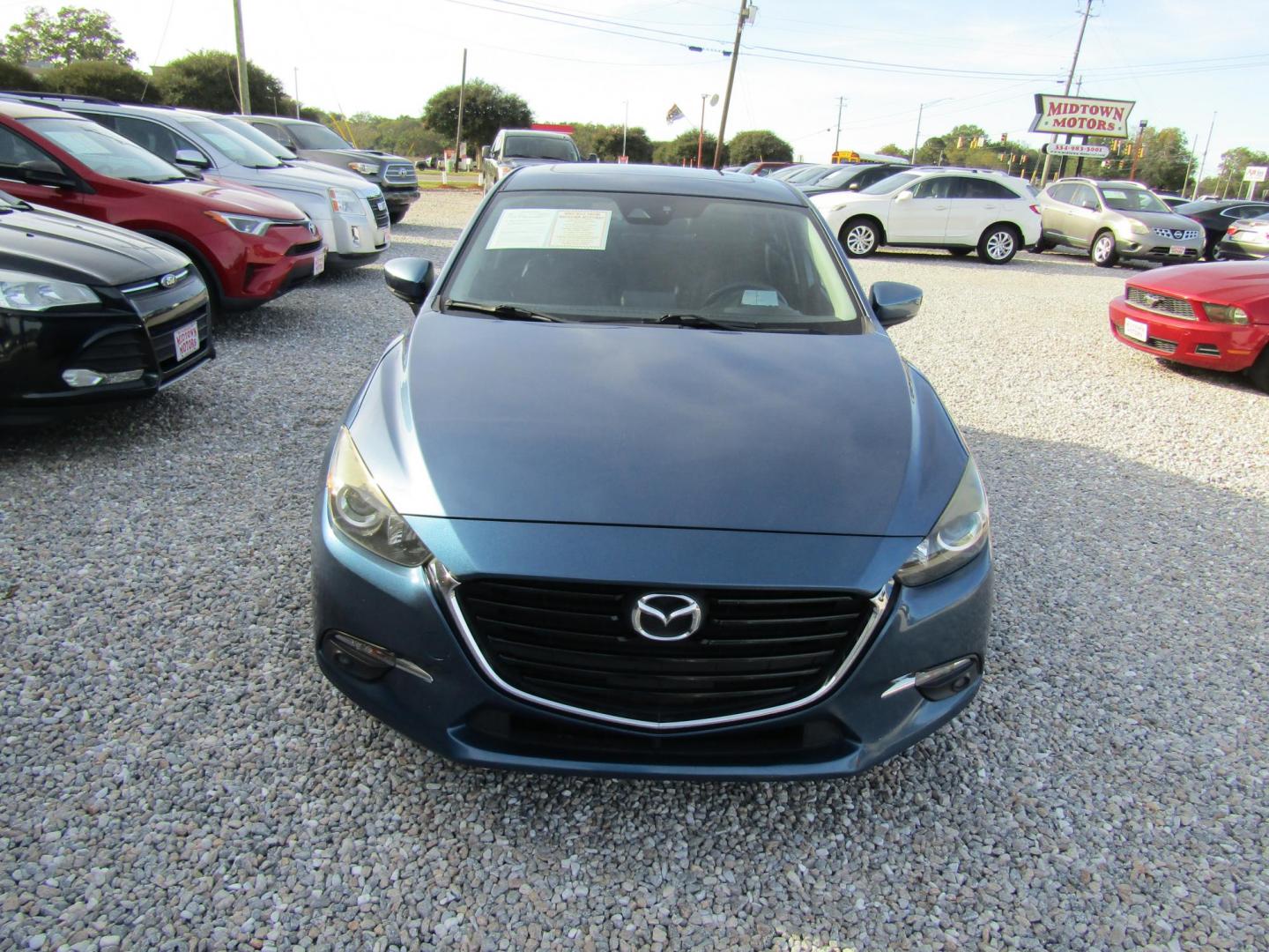 2017 Blue Mazda MAZDA3 s Grand Touring AT 4-Door (JM1BN1W31H1) with an 2.5L L4 DOHC 16V engine, Automatic transmission, located at 15016 S Hwy 231, Midland City, AL, 36350, (334) 983-3001, 31.306210, -85.495277 - Photo#1