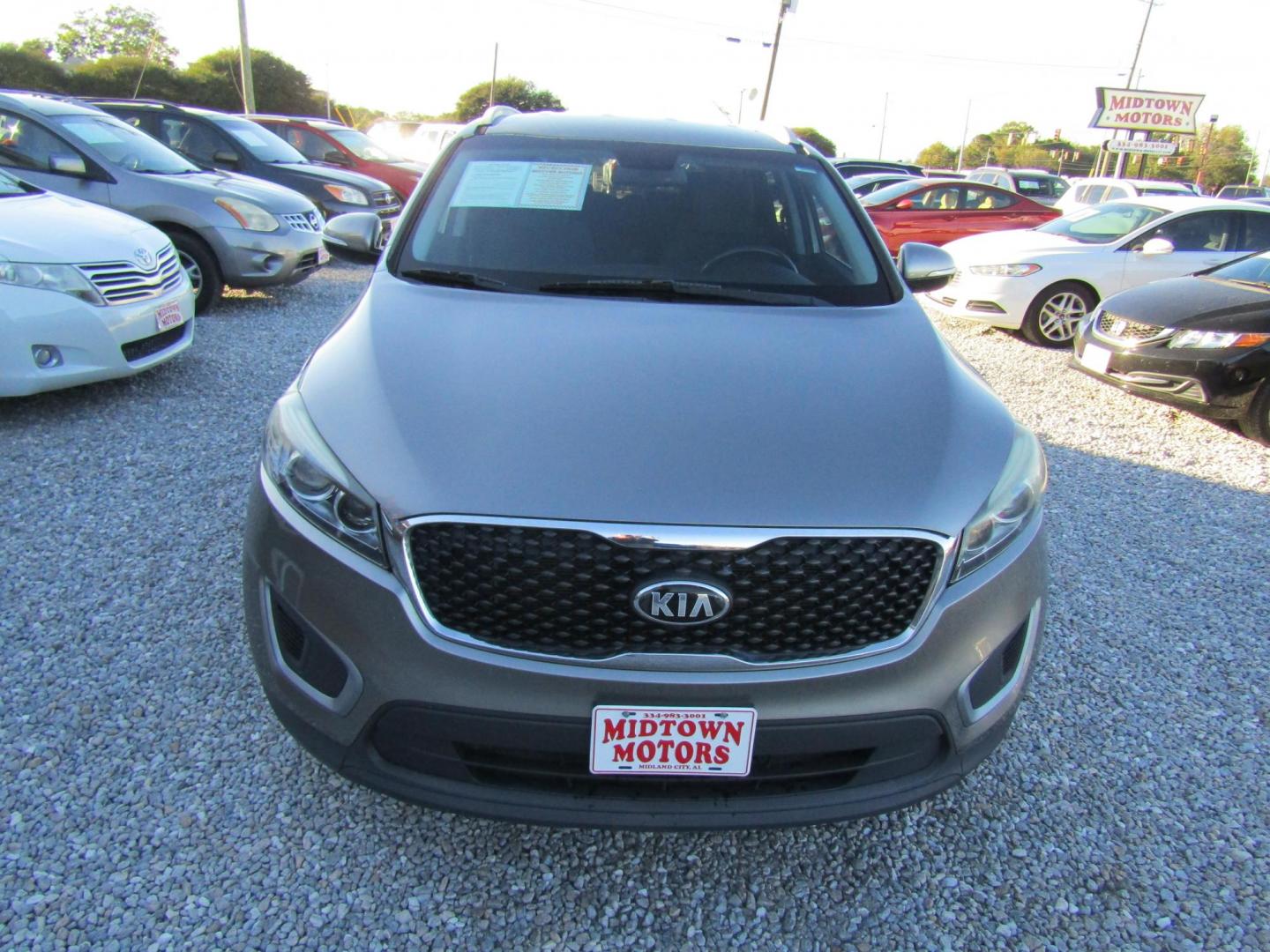 2017 Gold Kia Sorento L 2WD (5XYPG4A30HG) with an 2.4L L4 DOHC 16V engine, Automatic transmission, located at 15016 S Hwy 231, Midland City, AL, 36350, (334) 983-3001, 31.306210, -85.495277 - Photo#1