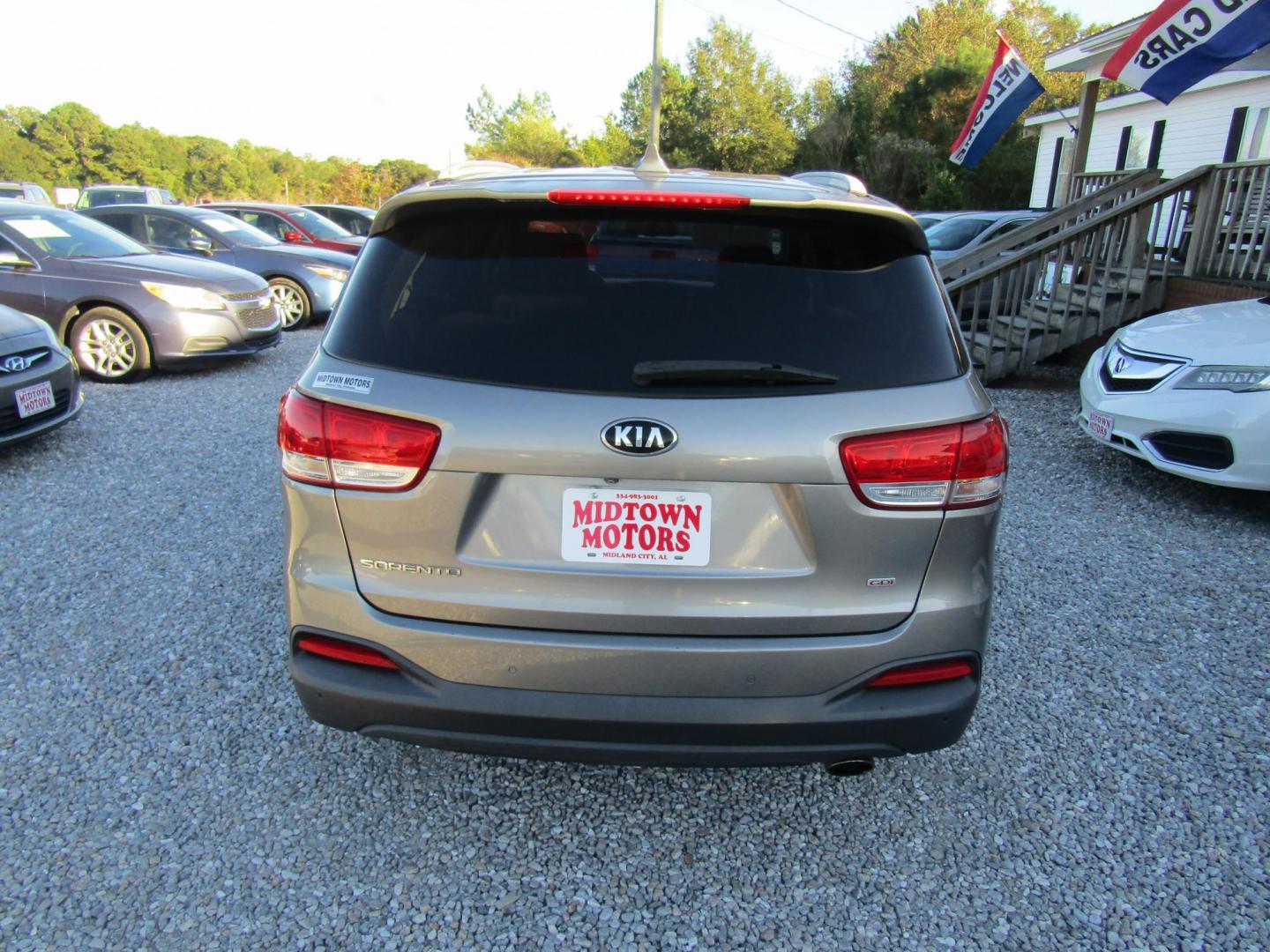 2017 Gold Kia Sorento L 2WD (5XYPG4A30HG) with an 2.4L L4 DOHC 16V engine, Automatic transmission, located at 15016 S Hwy 231, Midland City, AL, 36350, (334) 983-3001, 31.306210, -85.495277 - Photo#6
