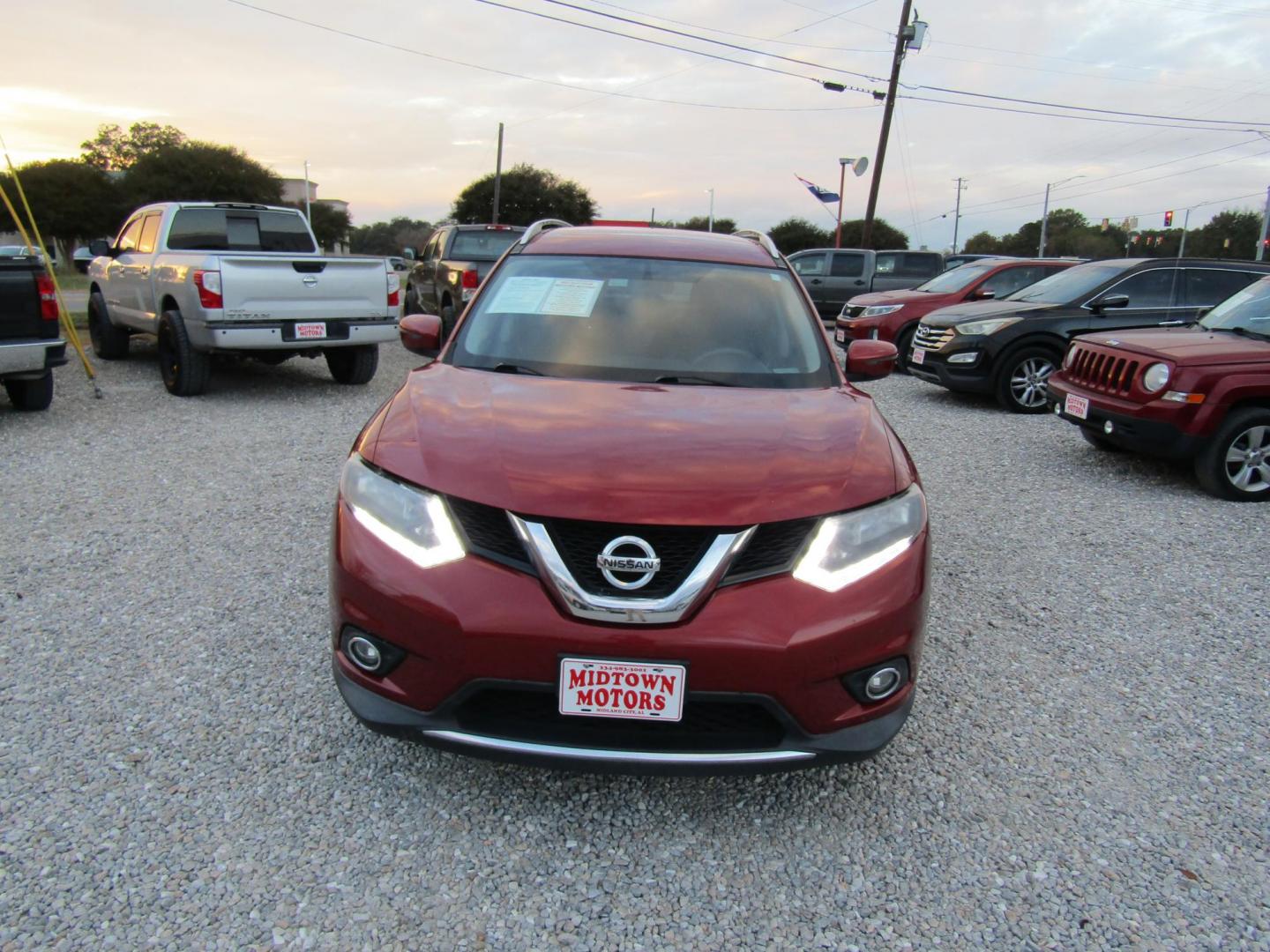 2016 Red Nissan Rogue S 2WD (KNMAT2MT8GP) with an 2.5L L4 DOHC 16V engine, CVT transmission, located at 15016 S Hwy 231, Midland City, AL, 36350, (334) 983-3001, 31.306210, -85.495277 - Photo#1