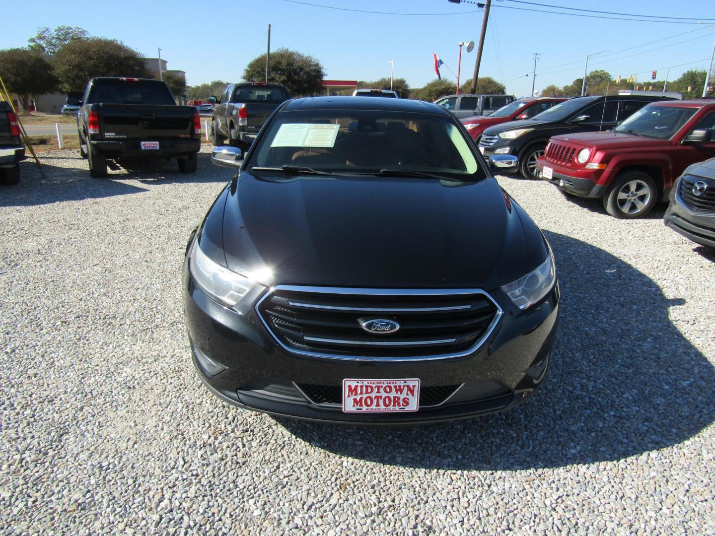 2013 Black Ford Taurus Limited FWD (1FAHP2F80DG) with an 3.5L V6 DOHC 24V engine, Automatic transmission, located at 15016 S Hwy 231, Midland City, AL, 36350, (334) 983-3001, 31.306210, -85.495277 - Photo#1