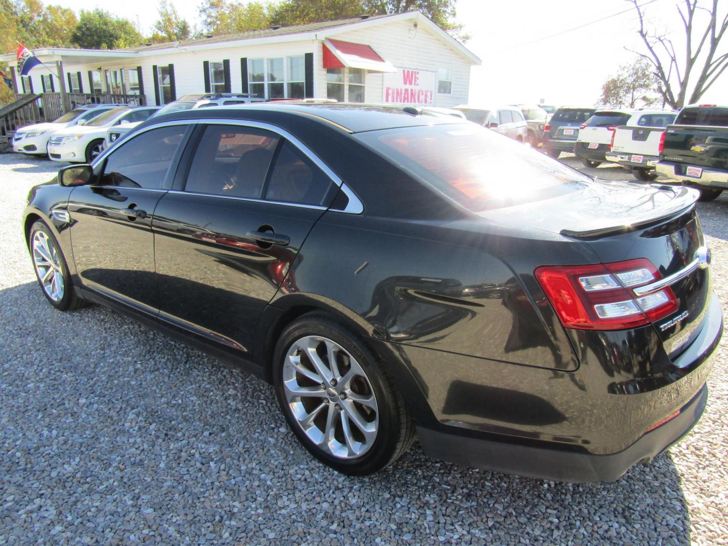 2013 Black Ford Taurus Limited FWD (1FAHP2F80DG) with an 3.5L V6 DOHC 24V engine, Automatic transmission, located at 15016 S Hwy 231, Midland City, AL, 36350, (334) 983-3001, 31.306210, -85.495277 - Photo#5