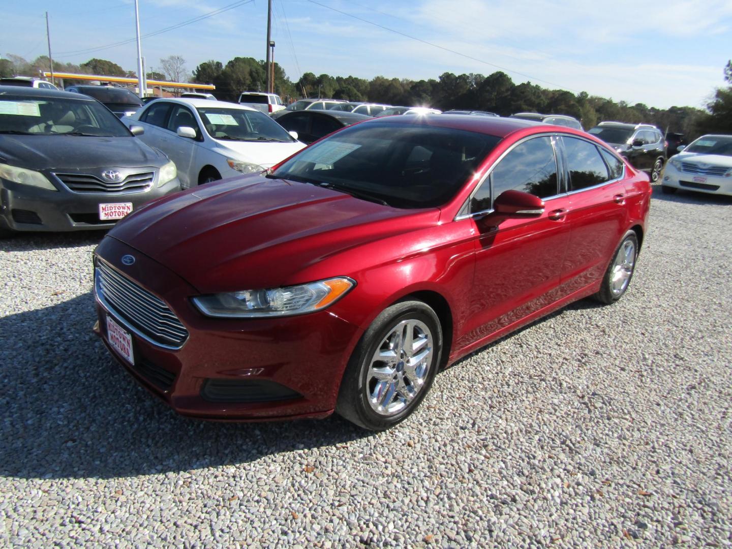 2014 Red Ford Fusion SE (1FA6P0H71E5) with an 2.5L L4 DOHC 16V engine, Automatic transmission, located at 15016 S Hwy 231, Midland City, AL, 36350, (334) 983-3001, 31.306210, -85.495277 - Photo#2
