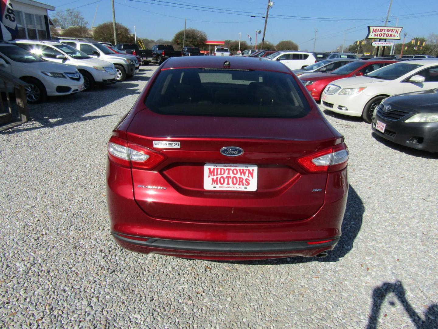 2014 Red Ford Fusion SE (1FA6P0H71E5) with an 2.5L L4 DOHC 16V engine, Automatic transmission, located at 15016 S Hwy 231, Midland City, AL, 36350, (334) 983-3001, 31.306210, -85.495277 - Photo#6