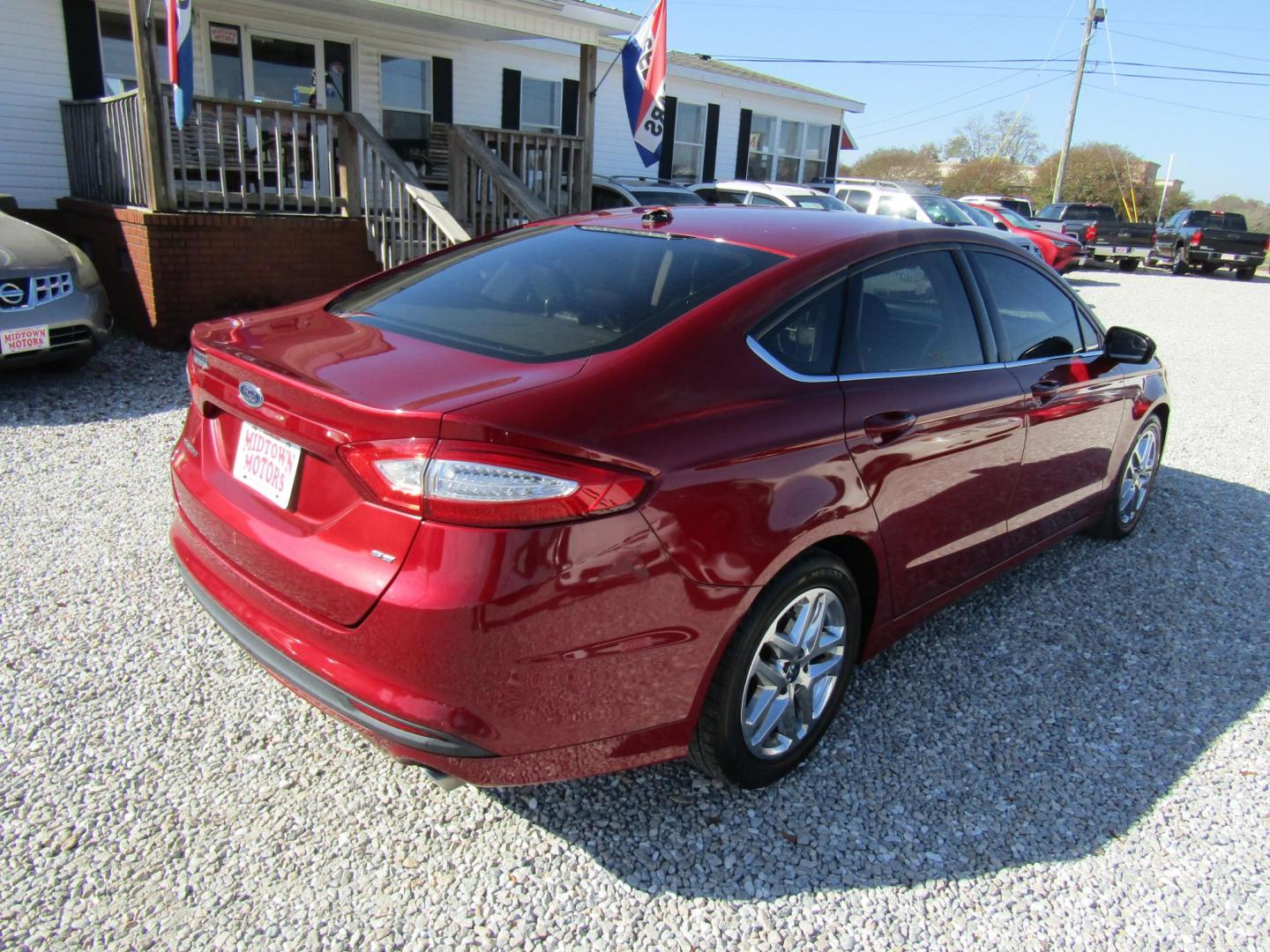 2014 Red Ford Fusion SE (1FA6P0H71E5) with an 2.5L L4 DOHC 16V engine, Automatic transmission, located at 15016 S Hwy 231, Midland City, AL, 36350, (334) 983-3001, 31.306210, -85.495277 - Photo#7