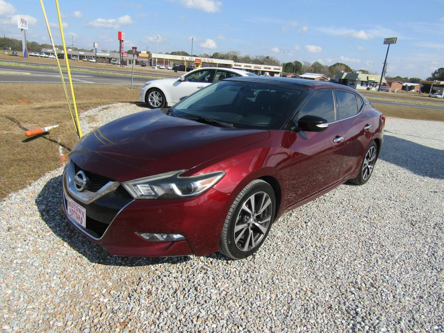 2016 Red Nissan Maxima 3.5 S (1N4AA6AP6GC) with an 3.5L V6 DOHC 24V engine, Automatic transmission, located at 15016 S Hwy 231, Midland City, AL, 36350, (334) 983-3001, 31.306210, -85.495277 - Photo#2