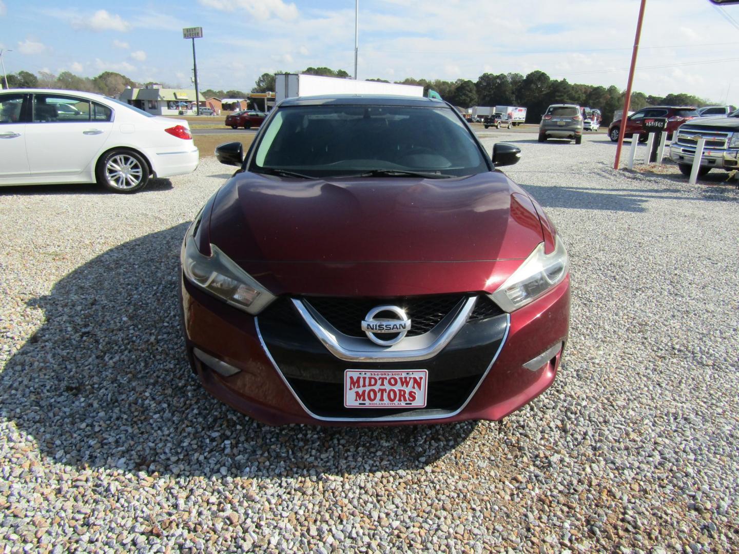 2016 Red Nissan Maxima 3.5 S (1N4AA6AP6GC) with an 3.5L V6 DOHC 24V engine, Automatic transmission, located at 15016 S Hwy 231, Midland City, AL, 36350, (334) 983-3001, 31.306210, -85.495277 - Photo#1