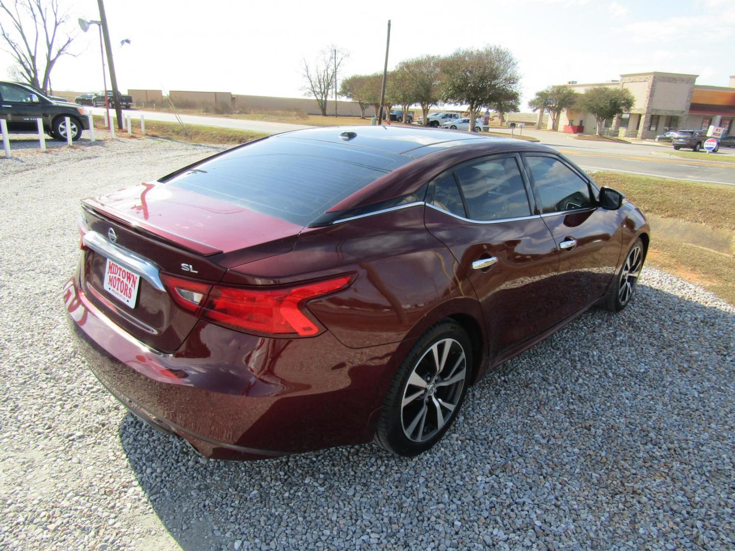 2016 Red Nissan Maxima 3.5 S (1N4AA6AP6GC) with an 3.5L V6 DOHC 24V engine, Automatic transmission, located at 15016 S Hwy 231, Midland City, AL, 36350, (334) 983-3001, 31.306210, -85.495277 - Photo#7