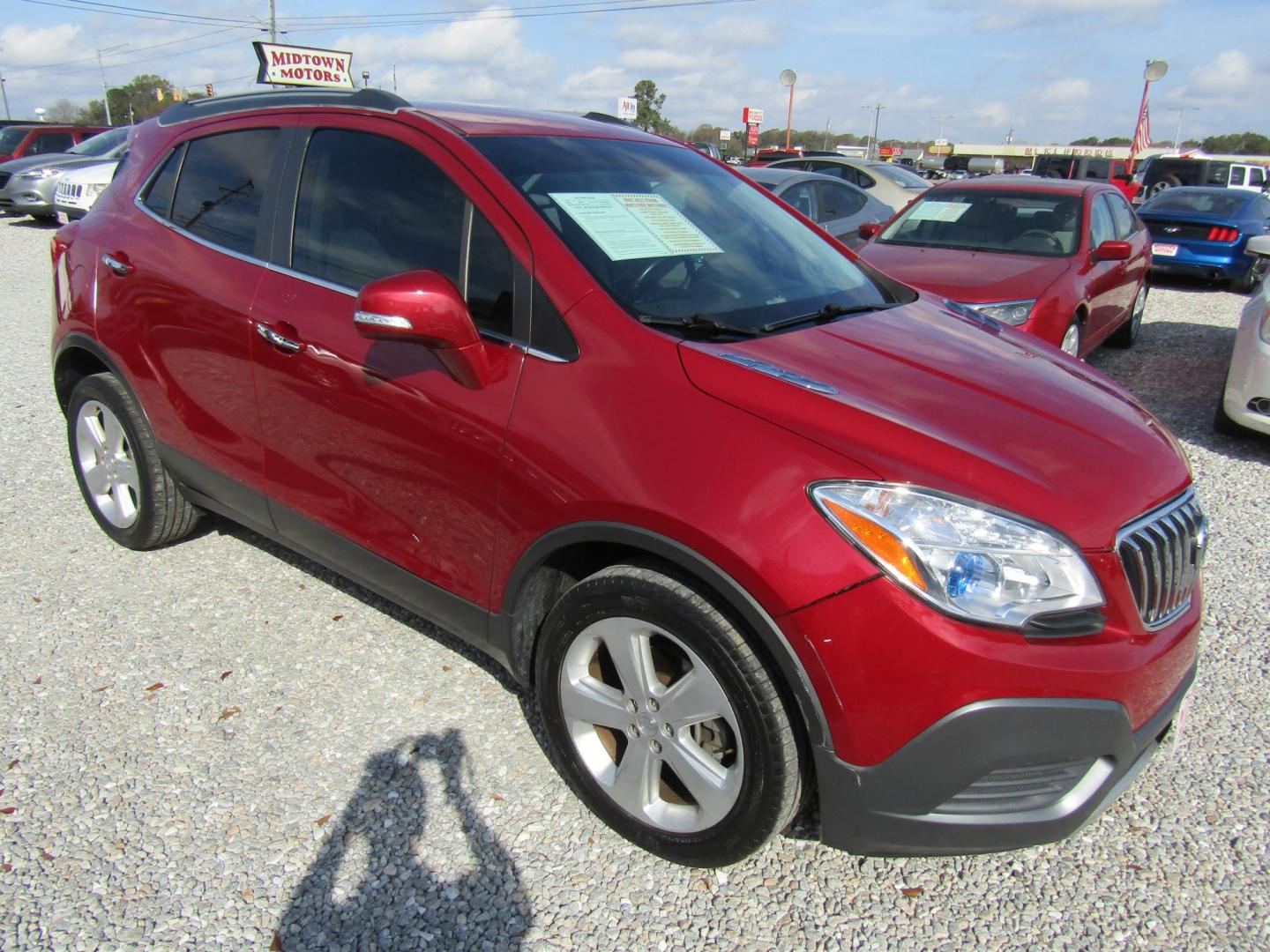 2015 Red Buick Encore Base FWD (KL4CJASB3FB) with an 1.4L L4 DOHC 16V TURBO engine, Automatic transmission, located at 15016 S Hwy 231, Midland City, AL, 36350, (334) 983-3001, 31.306210, -85.495277 - Photo#0
