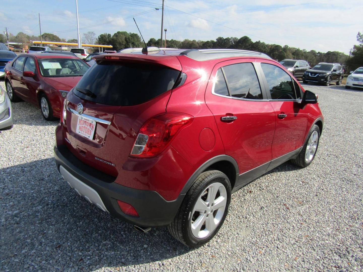 2015 Red Buick Encore Base FWD (KL4CJASB3FB) with an 1.4L L4 DOHC 16V TURBO engine, Automatic transmission, located at 15016 S Hwy 231, Midland City, AL, 36350, (334) 983-3001, 31.306210, -85.495277 - Photo#7