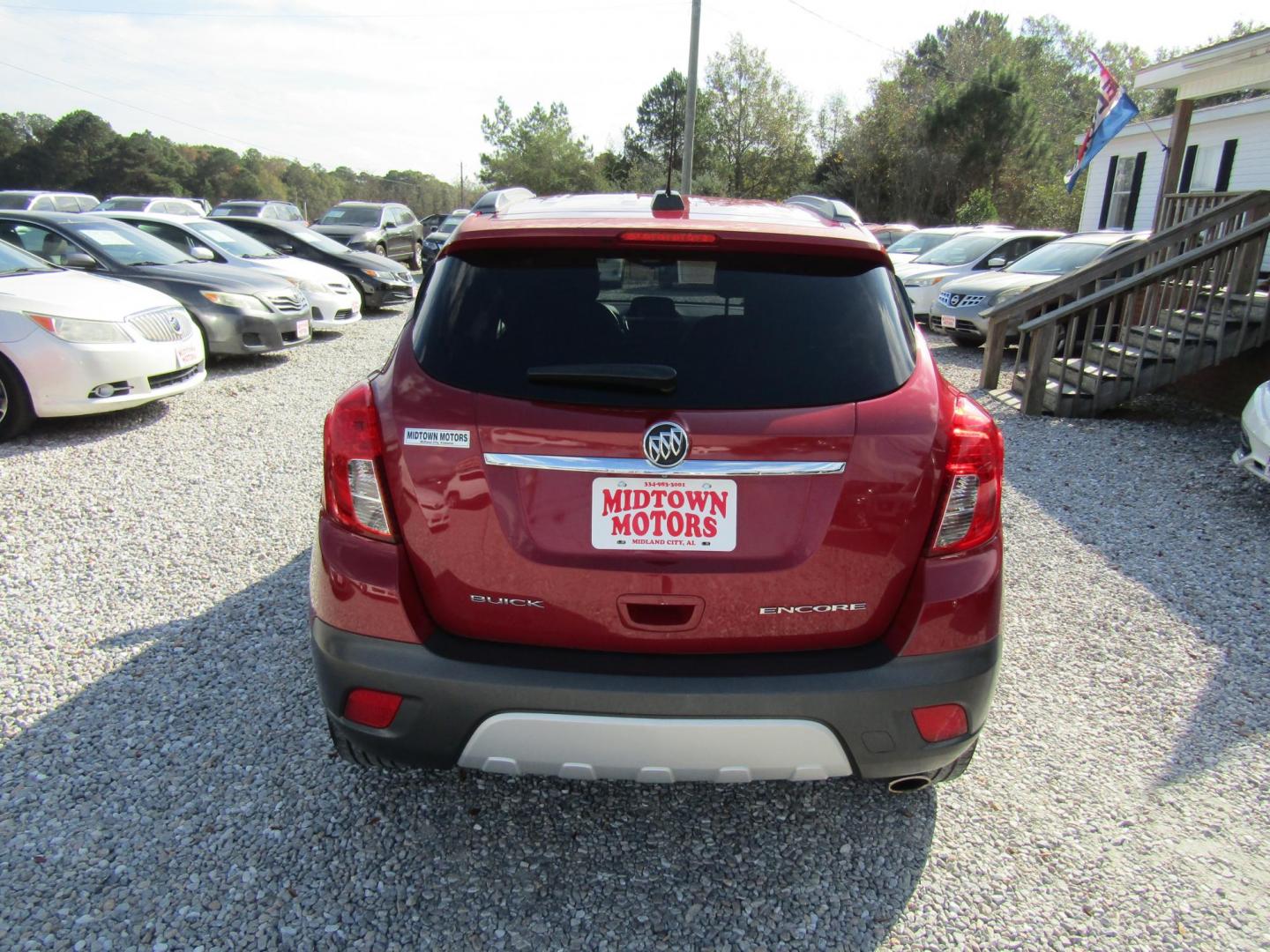 2015 Red Buick Encore Base FWD (KL4CJASB3FB) with an 1.4L L4 DOHC 16V TURBO engine, Automatic transmission, located at 15016 S Hwy 231, Midland City, AL, 36350, (334) 983-3001, 31.306210, -85.495277 - Photo#6