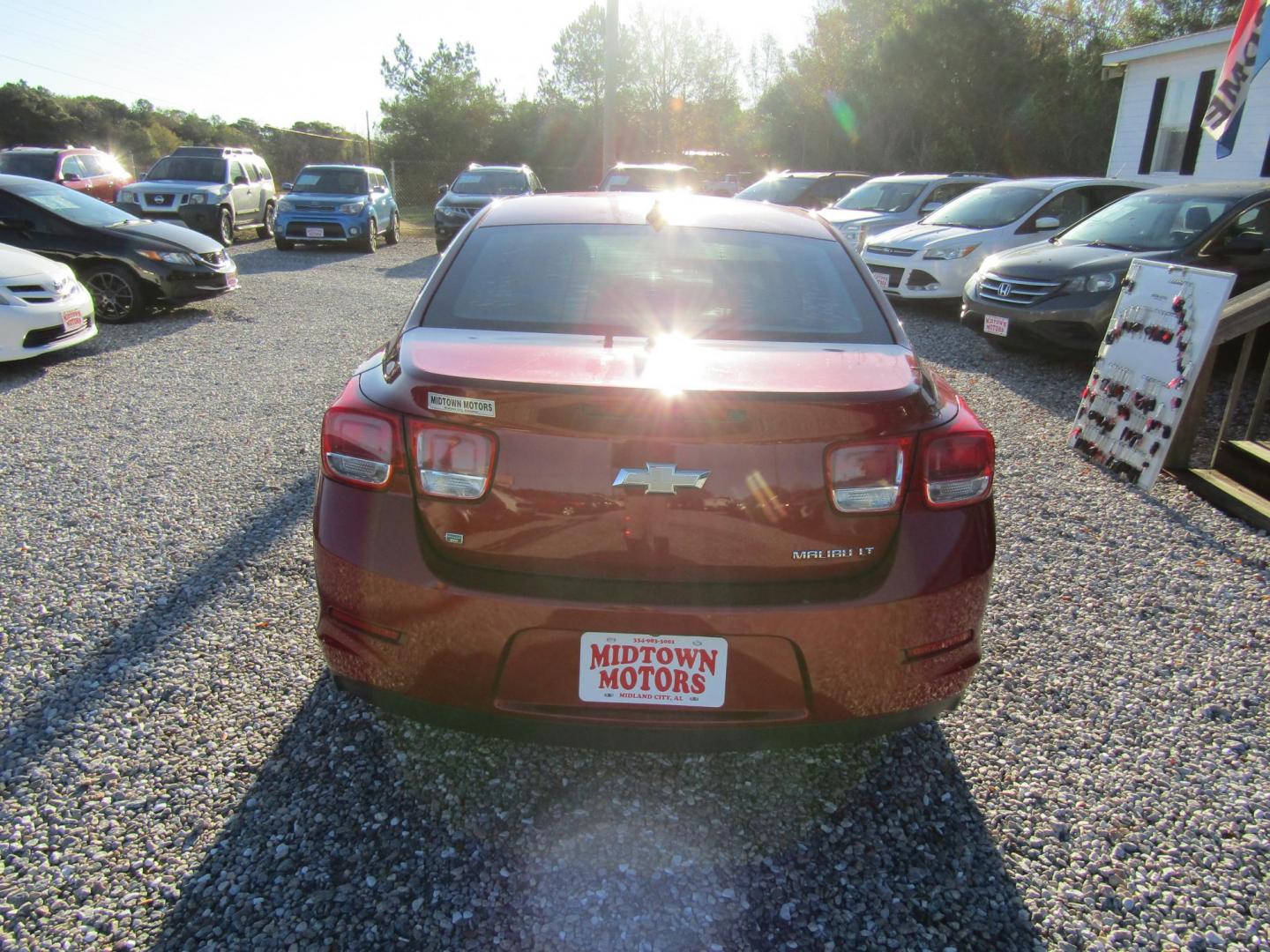 2014 Red Chevrolet Malibu 1LT (1G11C5SL3EF) with an 2.5L L4 DOHC 16V engine, Automatic transmission, located at 15016 S Hwy 231, Midland City, AL, 36350, (334) 983-3001, 31.306210, -85.495277 - Photo#6