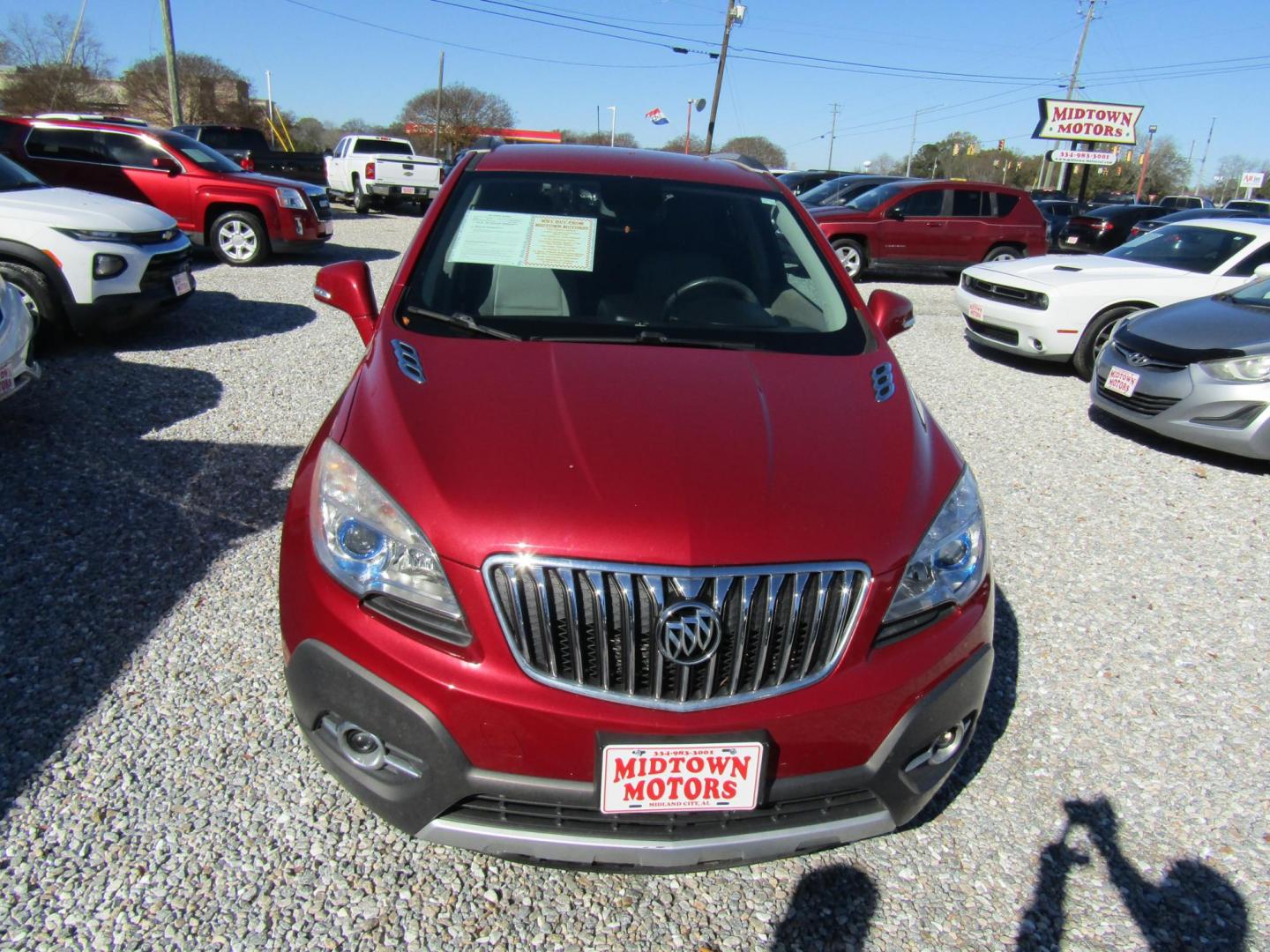 2015 Red Buick Encore Leather FWD (KL4CJCSB6FB) with an 1.4L L4 DOHC 16V TURBO engine, Automatic transmission, located at 15016 S Hwy 231, Midland City, AL, 36350, (334) 983-3001, 31.306210, -85.495277 - Photo#1